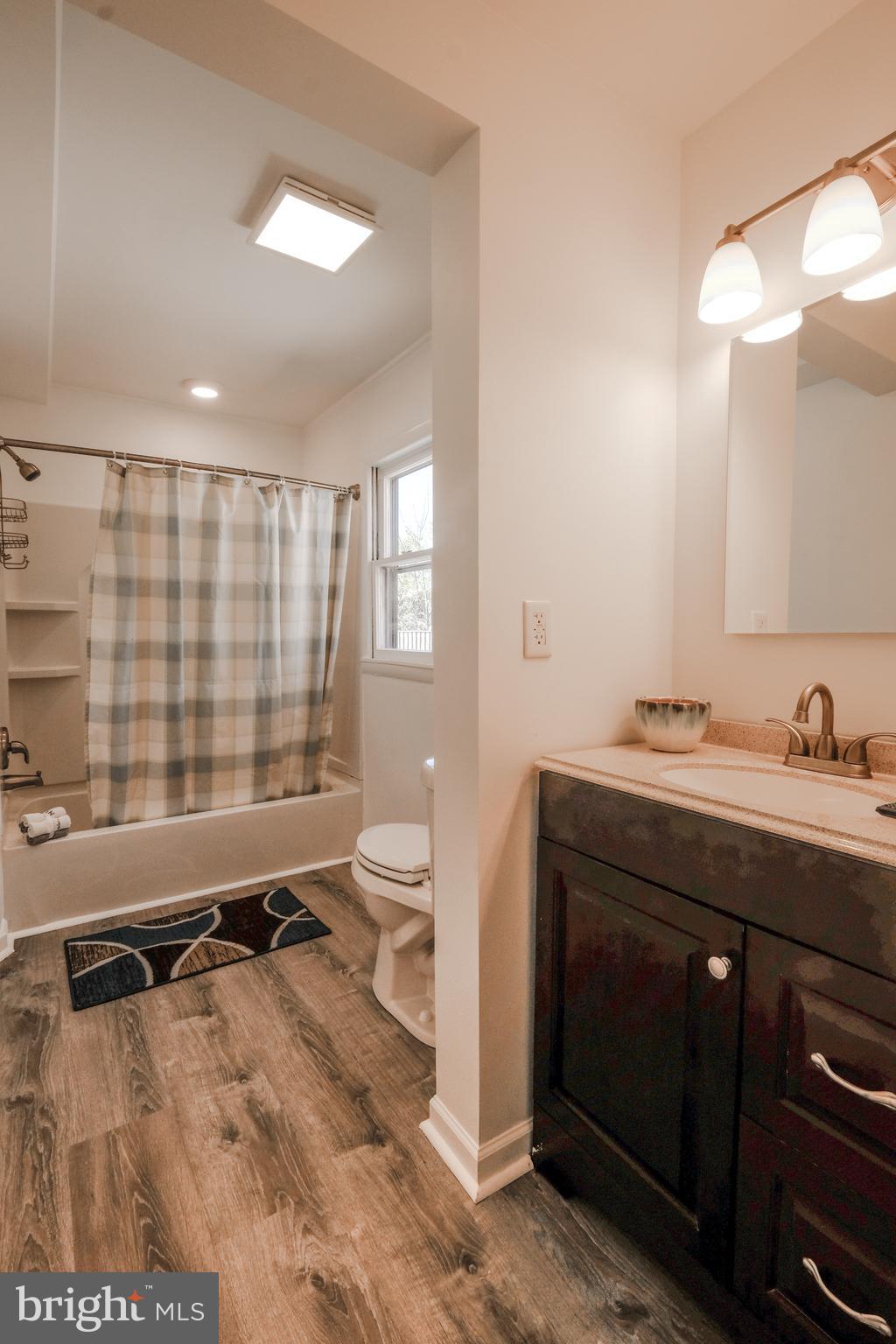 1542 Senseny Road Winchester, VA 22602 - Photo 9 of 23 a bathroom with a sink toilet and shower