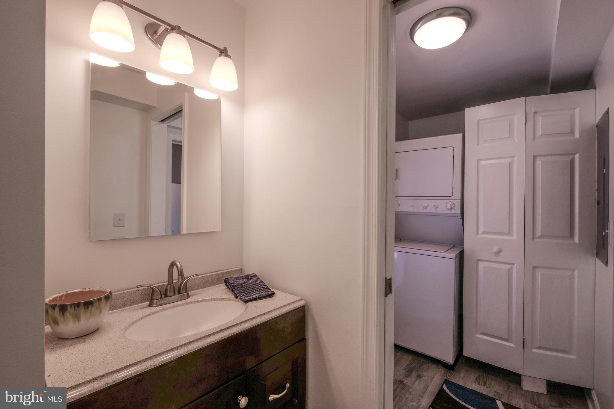 1542 Senseny Road Winchester, VA 22602 - Photo 10 of 23 a bathroom with a sink vanity and a mirror
