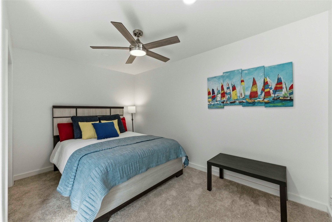 7309 Blessing Avenue Austin, TX 78752 - Photo 11 of 23 a bedroom with a bed and a painting on the wall