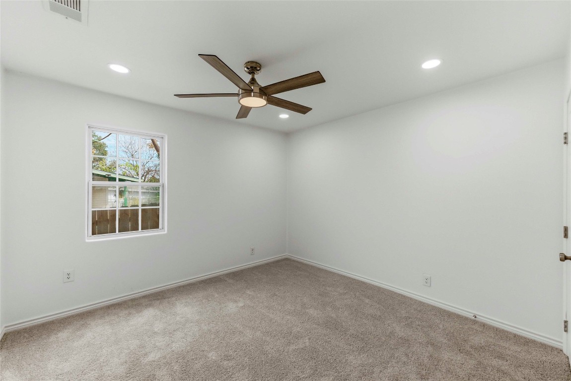 7309 Blessing Avenue Austin, TX 78752 - Photo 17 of 23 an empty room with a window and a ceiling fan