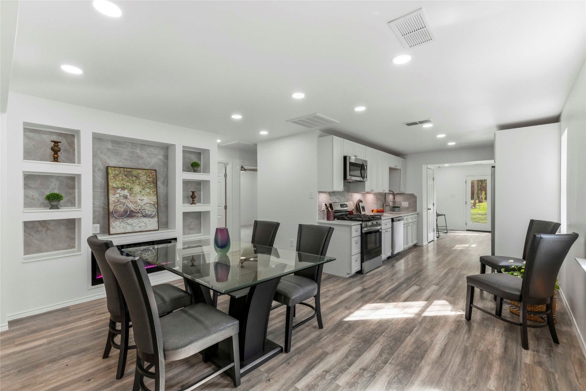 7309 Blessing Avenue Austin, TX 78752 - Photo 5 of 23 a view of a dining room with furniture window and wooden floor