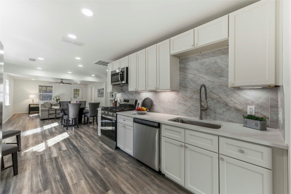 7309 Blessing Avenue Austin, TX 78752 - Photo 8 of 23 a kitchen with lots of counter top space and appliances