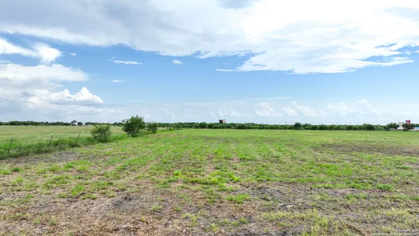 a view of a lake with houses in the back