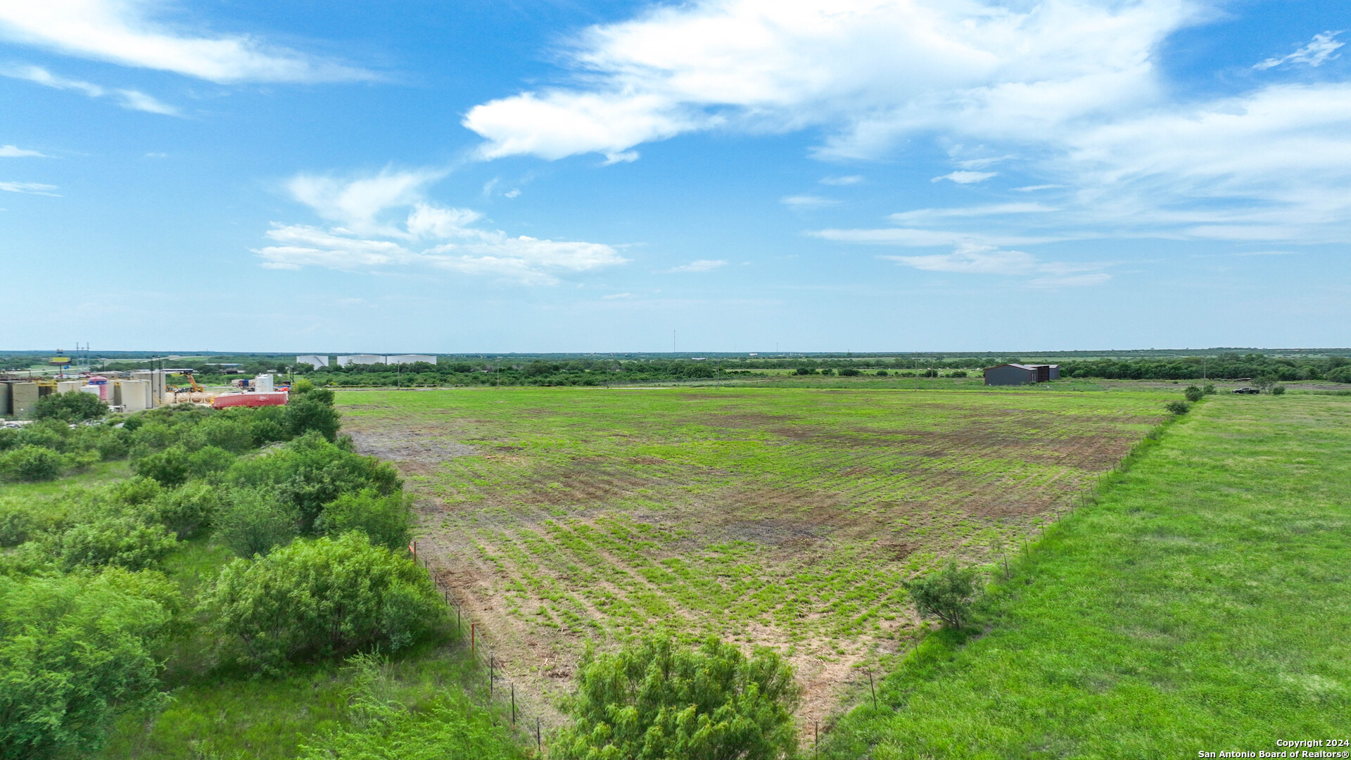 0 North I-37 Access Road Three Rivers, TX 78071 - Photo 6 of 11 a view of a lake with houses in the back