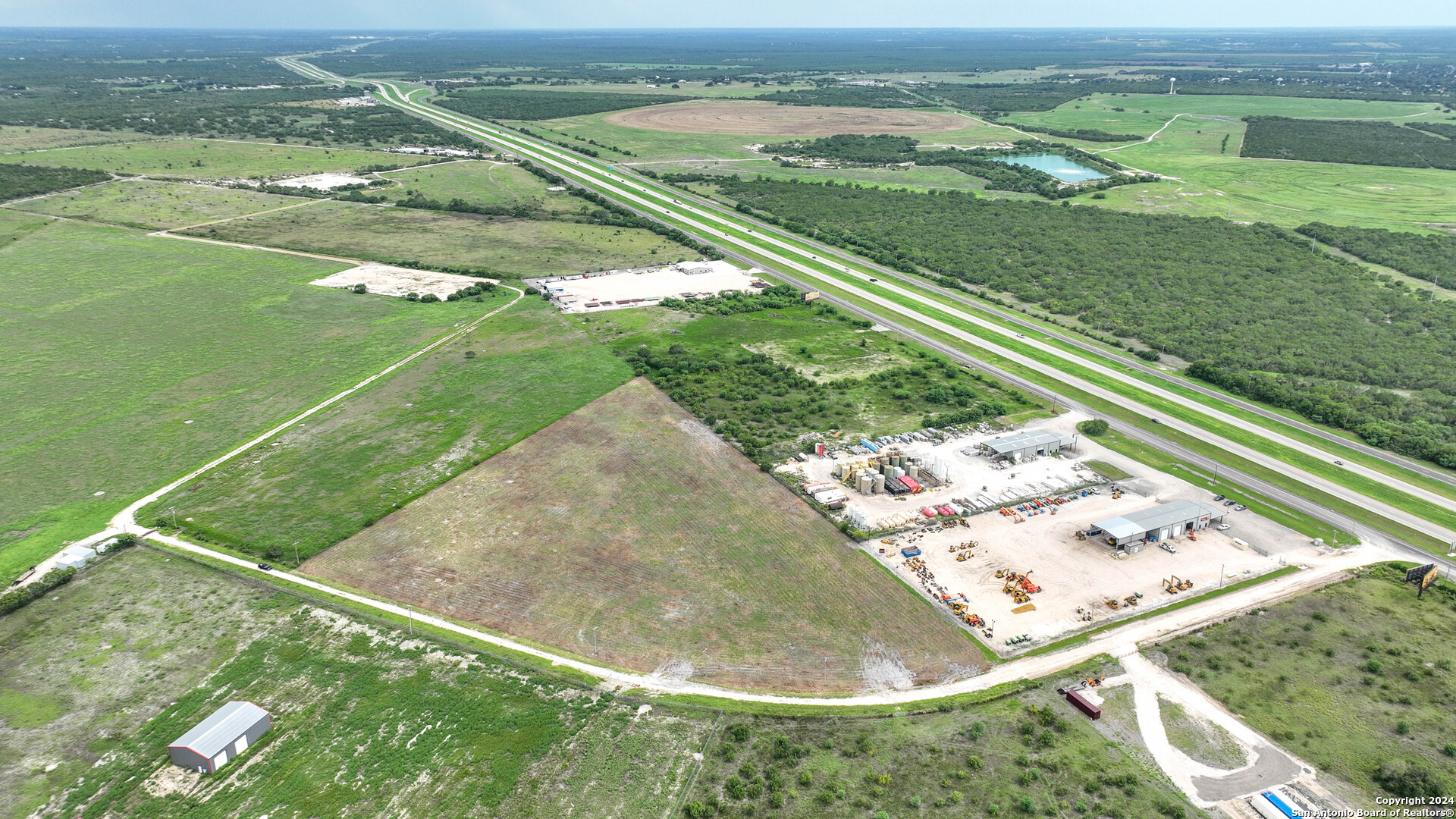 0 North I-37 Access Road Three Rivers, TX 78071 - Photo 7 of 11 a view of a lake from a yard