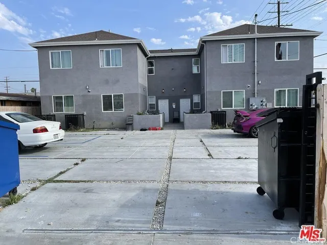 a cars parked in front of a brick building