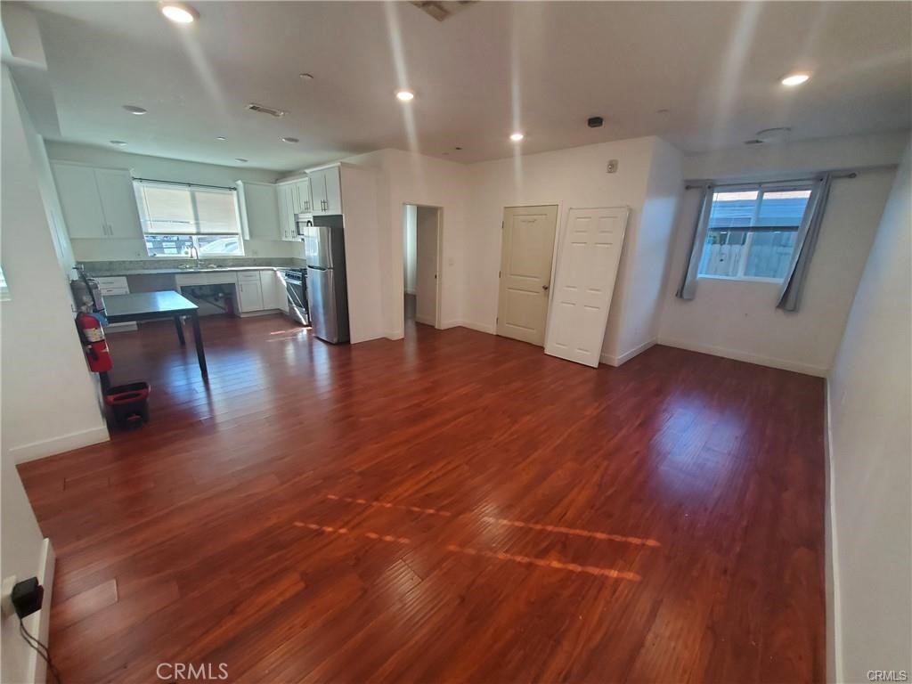 437 North Fries Avenue, Unit 1 Wilmington, CA 90744 - Photo 7 of 14 a view of a livingroom with furniture wooden floor and a window