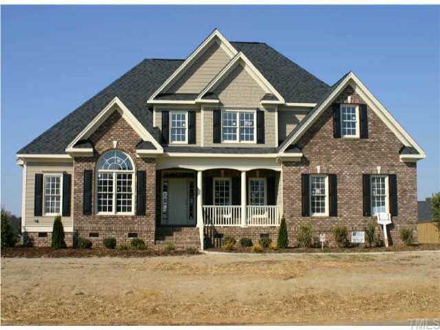 4708 Sandy Bay Circle Raleigh, NC 27603 - Photo 1 of 1 a front view of a house with a yard