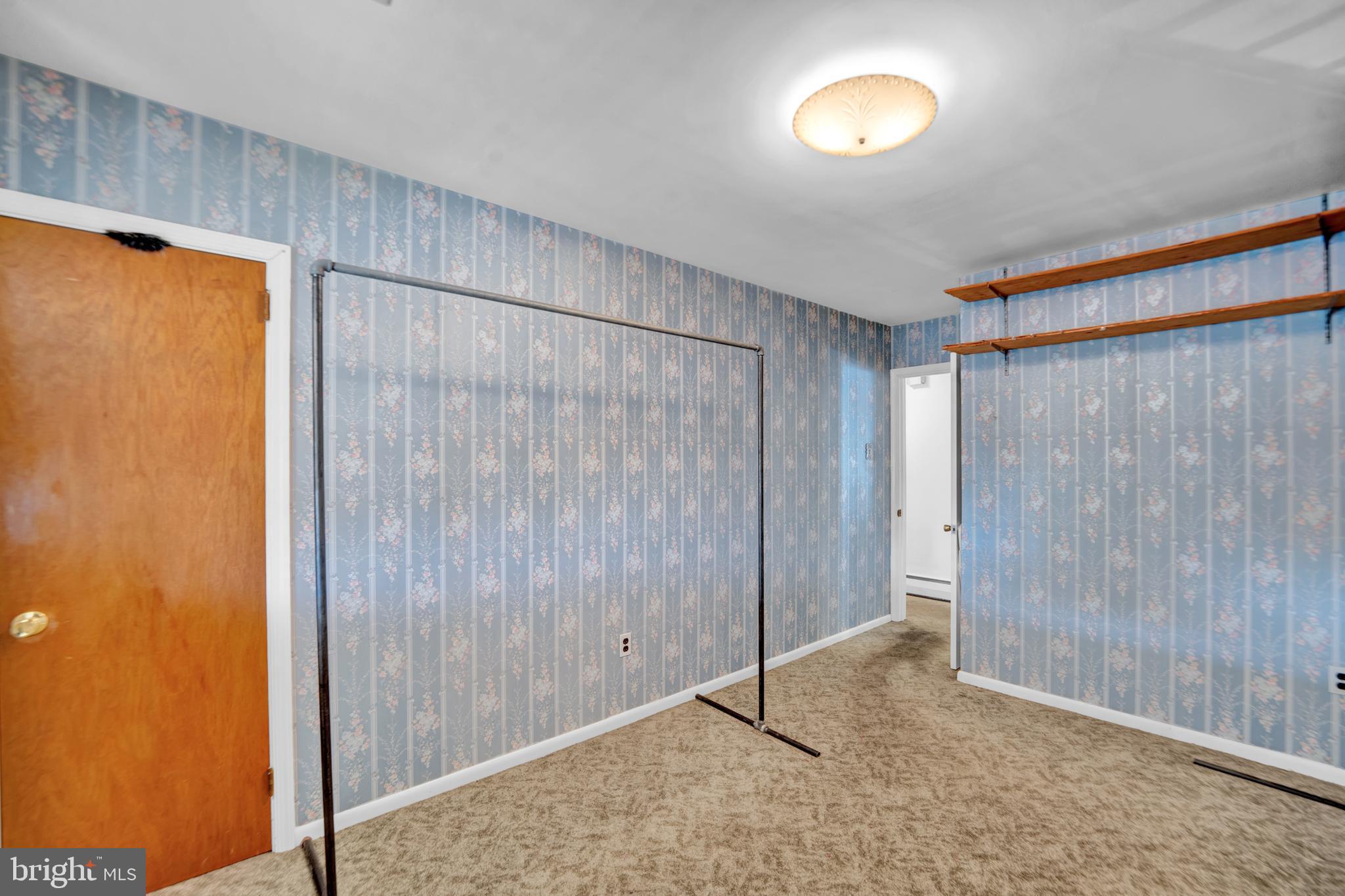 104 Gilmore Road Havertown, PA 19083 - Photo 15 of 47 a view of an empty room with wooden floor and a window
