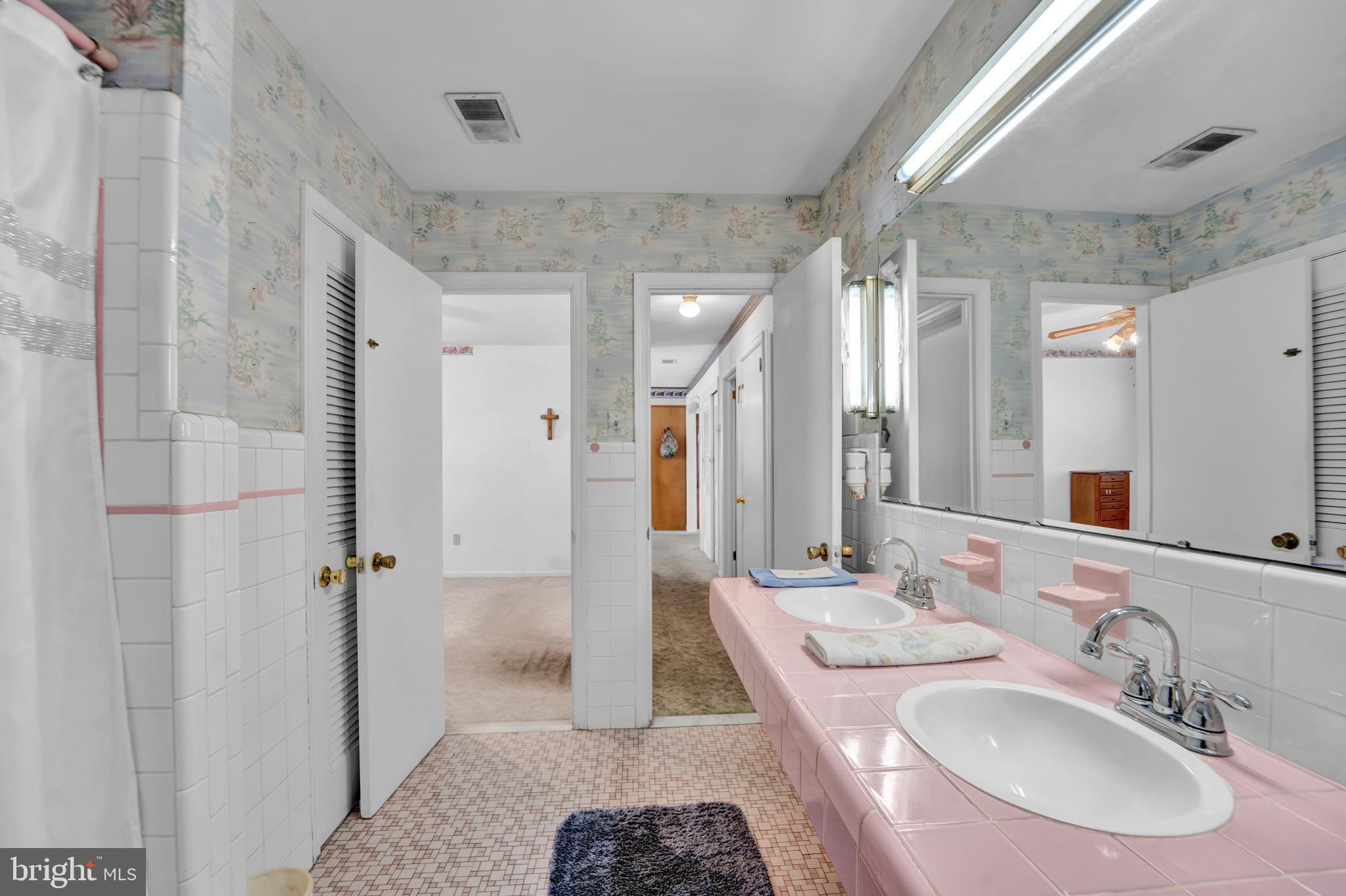 104 Gilmore Road Havertown, PA 19083 - Photo 16 of 47 a bathroom with a sink a toilet a mirror and shower