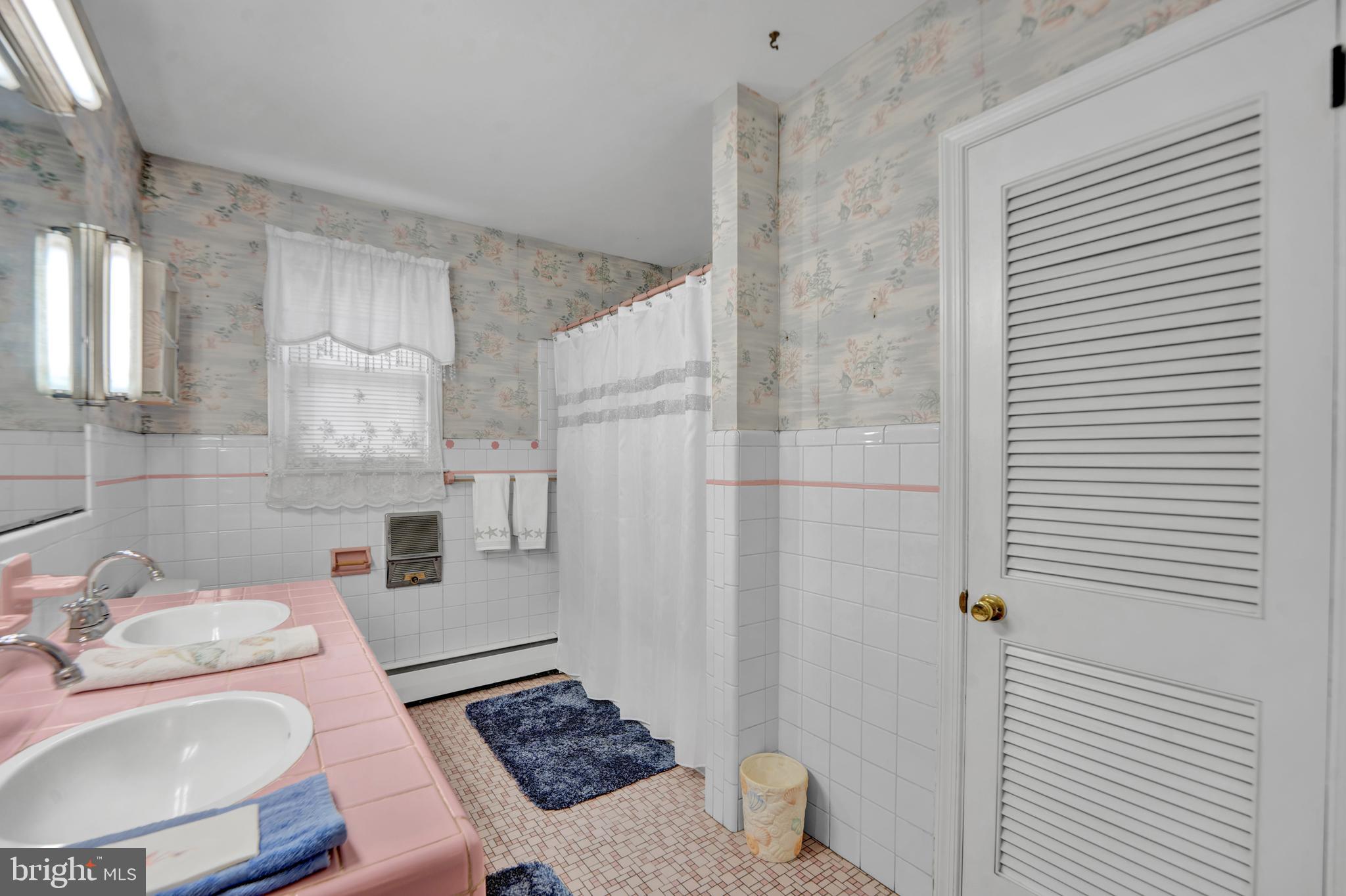 104 Gilmore Road Havertown, PA 19083 - Photo 17 of 47 a bathroom with a sink toilet and shower