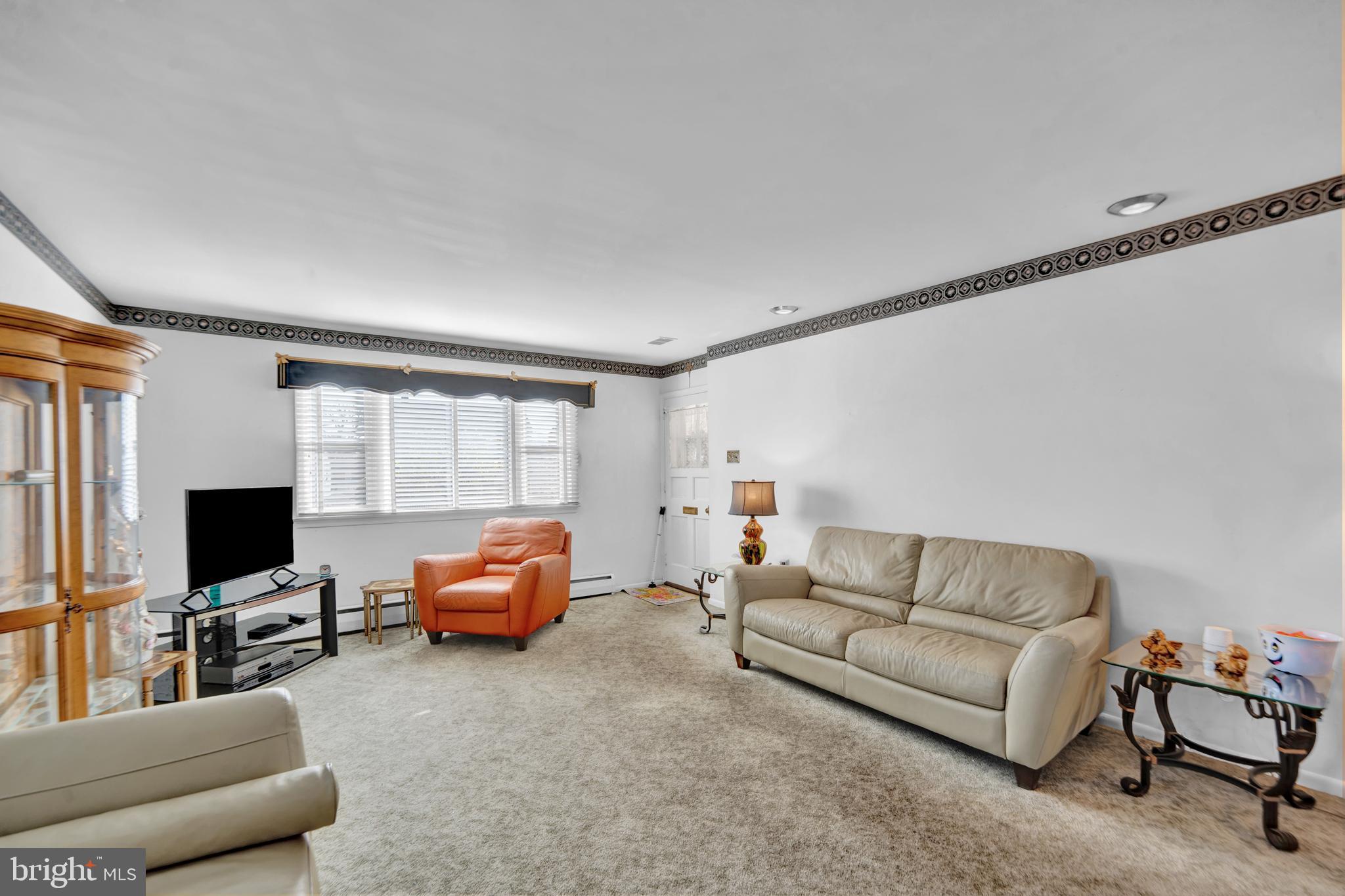 104 Gilmore Road Havertown, PA 19083 - Photo 2 of 47 a living room with furniture and a flat screen tv