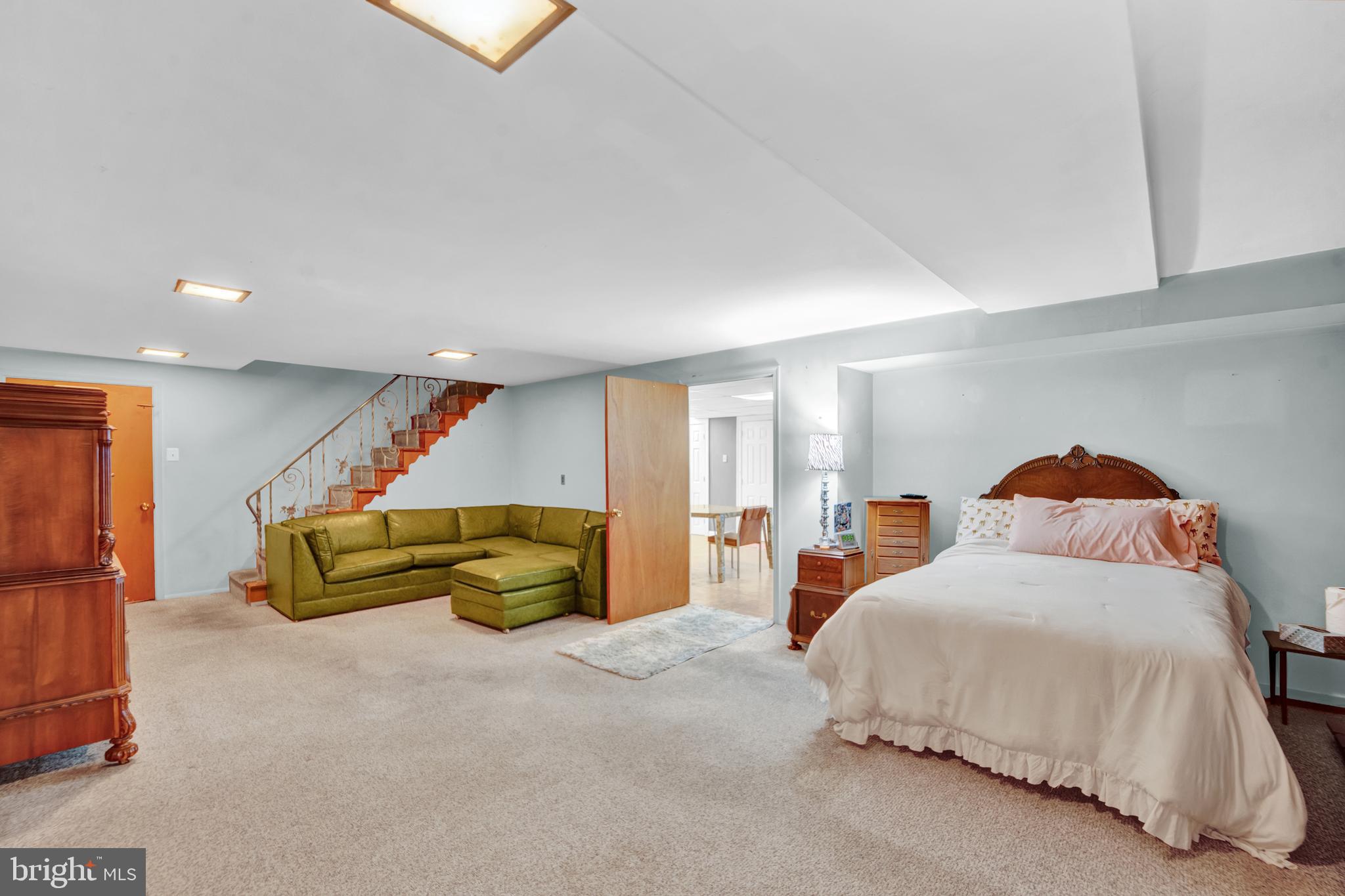 104 Gilmore Road Havertown, PA 19083 - Photo 27 of 47 a spacious bedroom with a bed and a couch