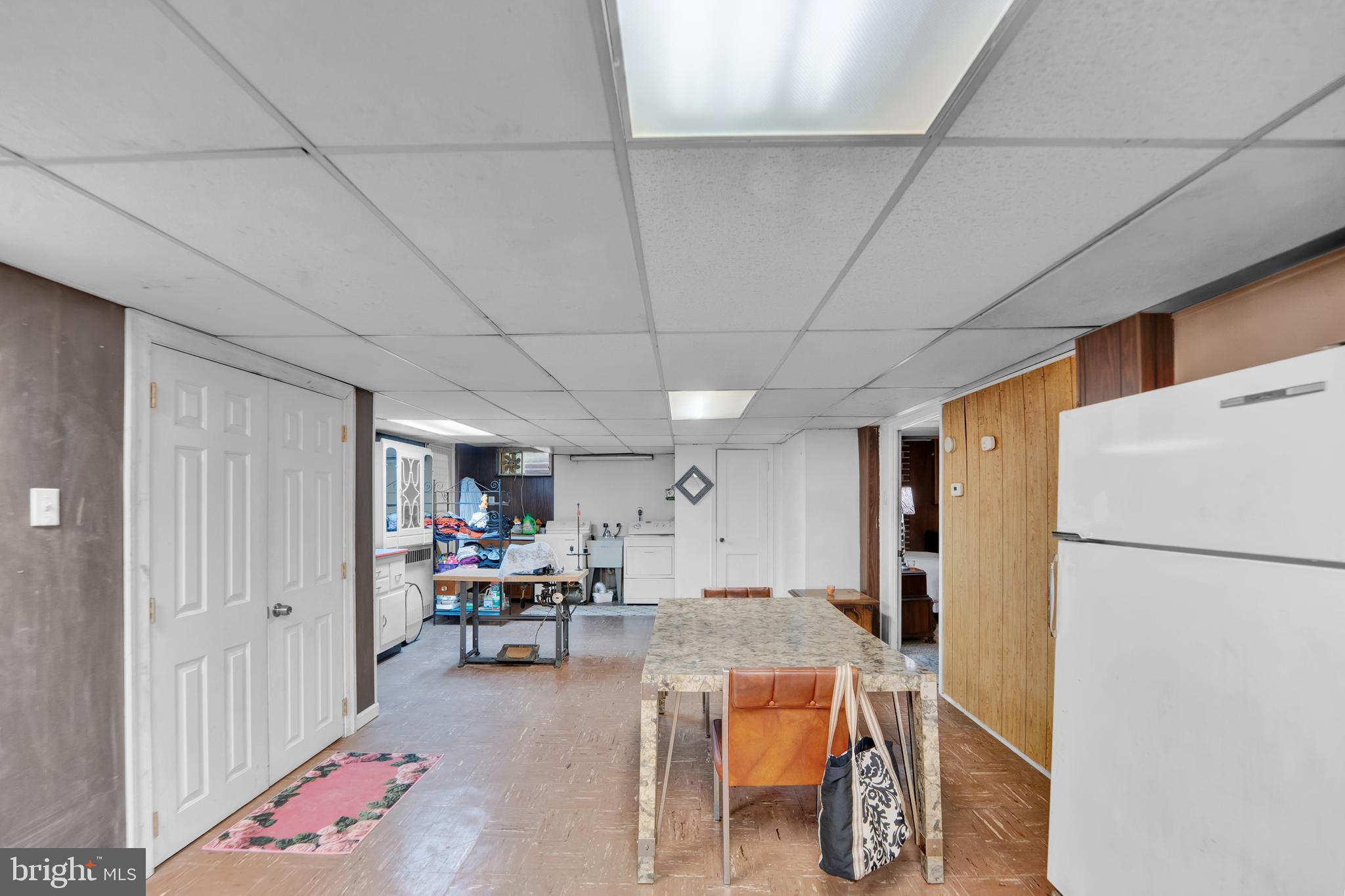 104 Gilmore Road Havertown, PA 19083 - Photo 33 of 47 a living room with furniture and a refrigerator