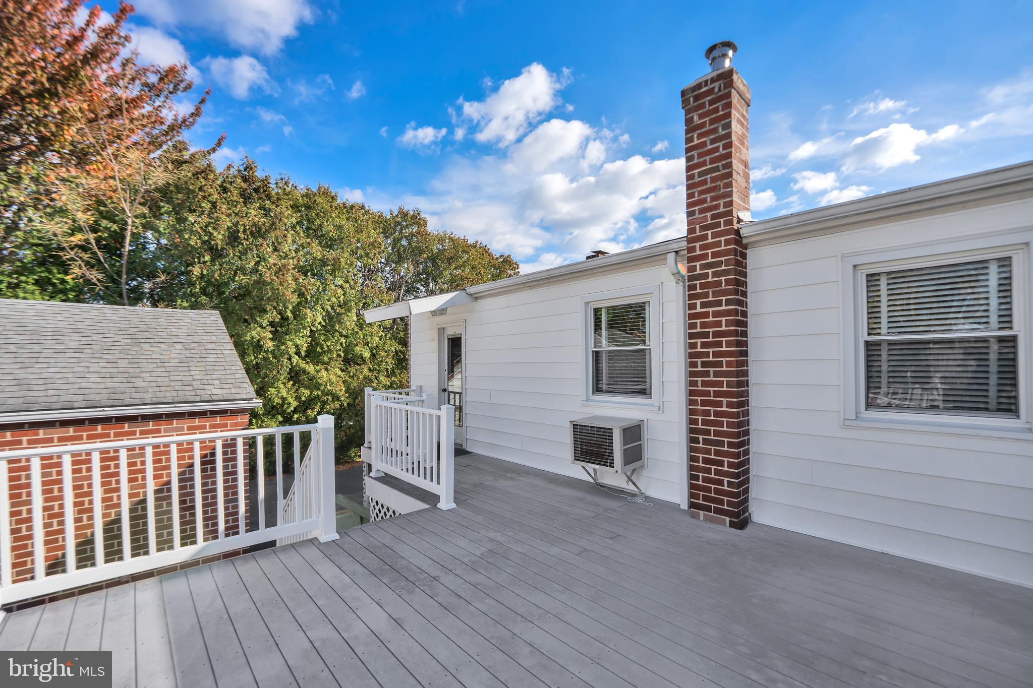 104 Gilmore Road Havertown, PA 19083 - Photo 36 of 47 a porch with a table and chairs