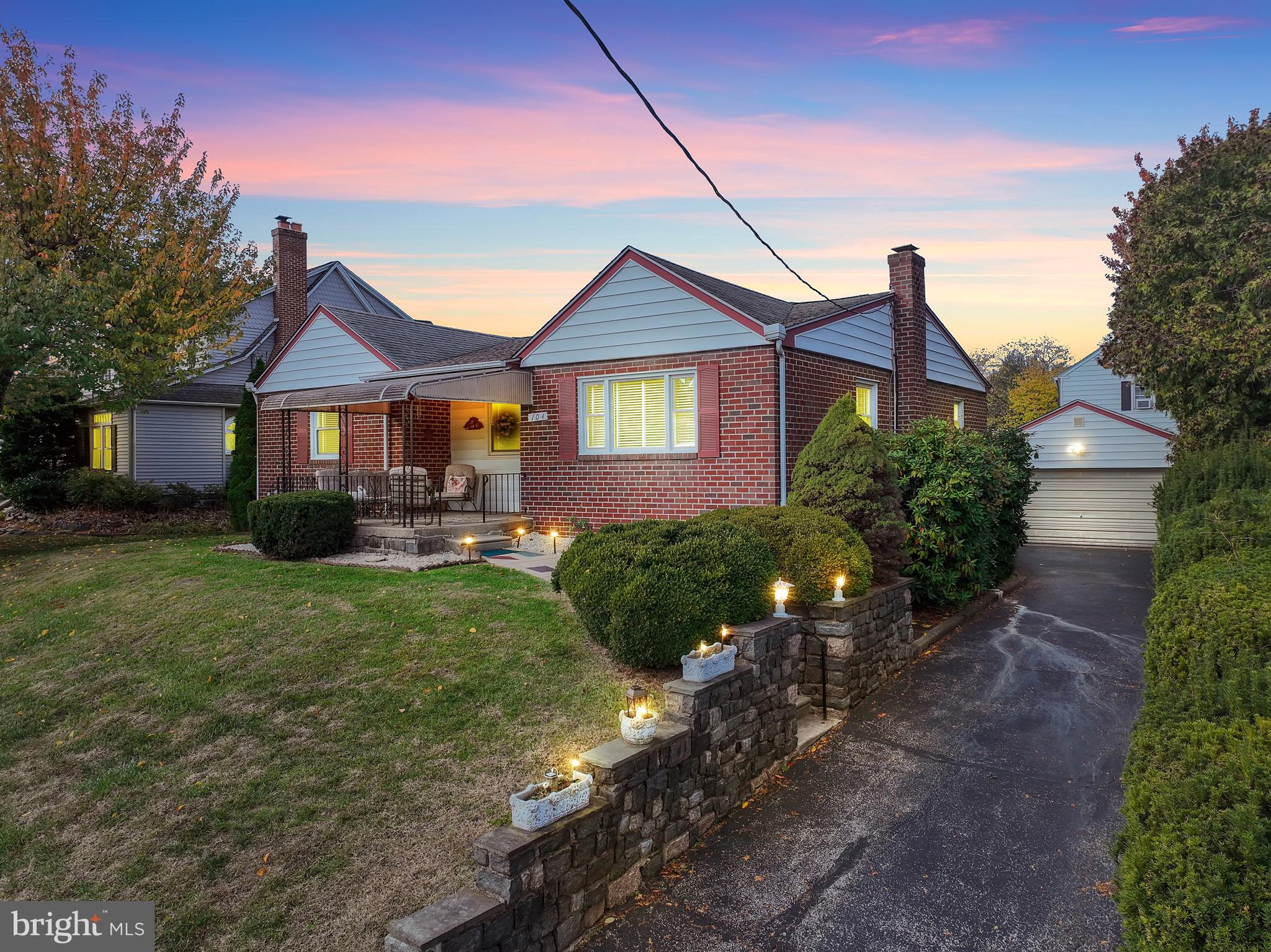 104 Gilmore Road Havertown, PA 19083 - Photo 40 of 47 a front view of a house with a yard and potted plants