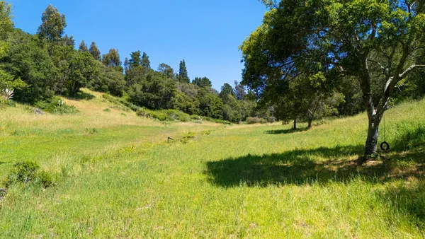 a view of a lake with a yard