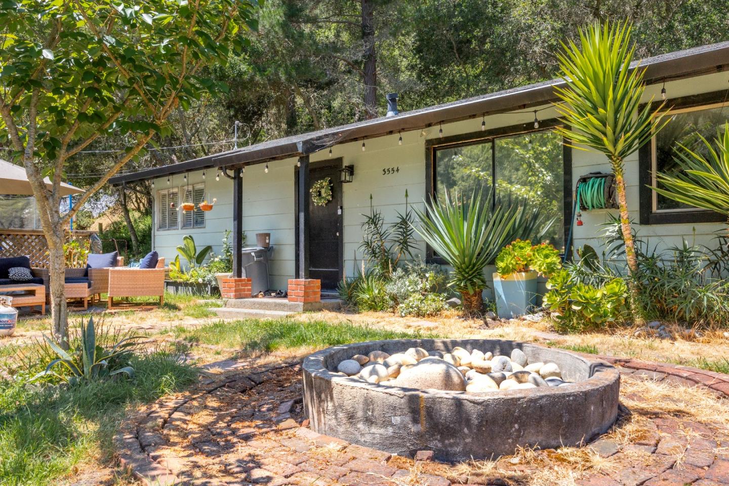 3554 Paul Sweet Road Santa Cruz, CA 95065 - Photo 24 of 30 a view of a backyard with plants and patio