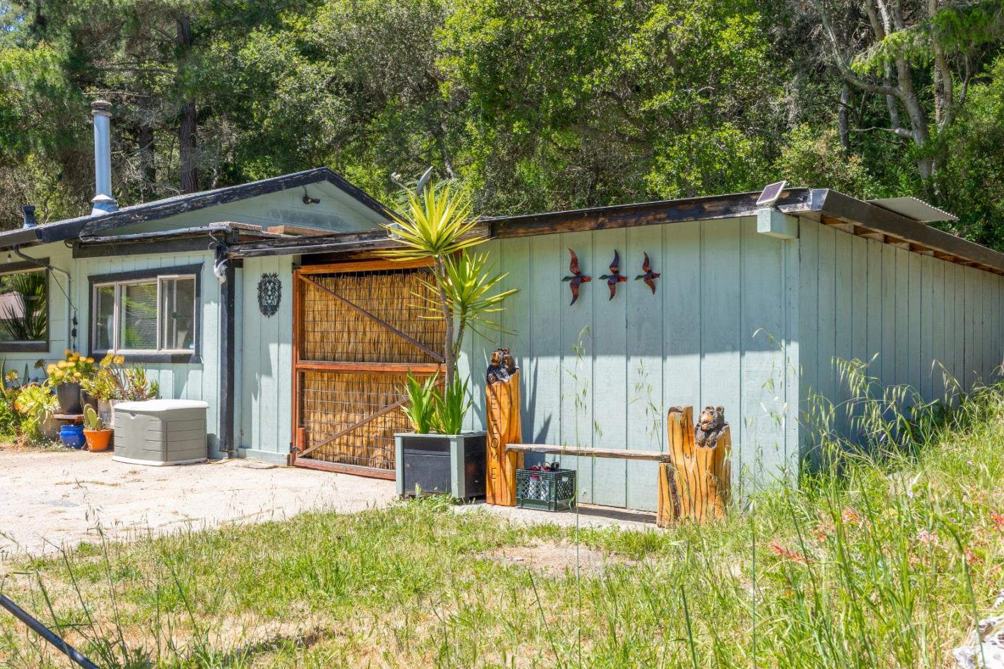 3554 Paul Sweet Road Santa Cruz, CA 95065 - Photo 27 of 30 a view of a backyard with table and chairs and potted plants