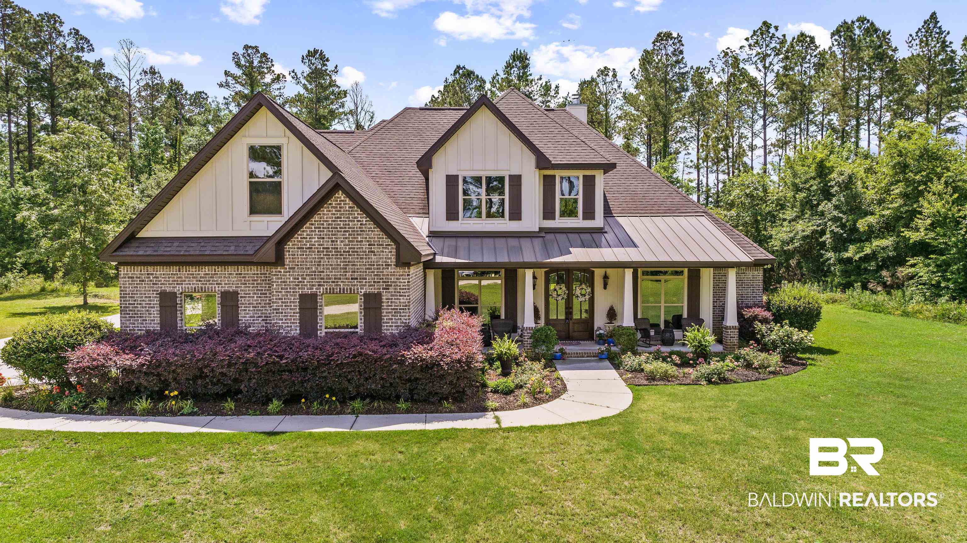 36784 Legacy Way Bay Minette, AL 36507 - Photo 56 of 57 View of front of house with brick siding, a front yard, a shingled roof, board and batten siding, and a porch