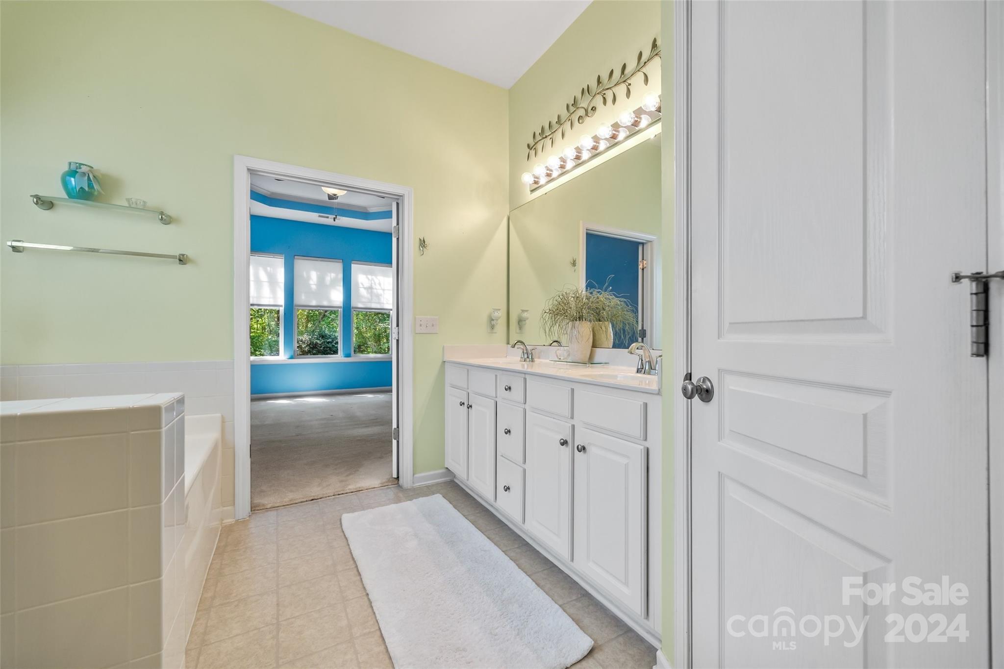 296 Sand Paver Way Fort Mill, SC 29708 - Photo 21 of 41 a spacious bathroom with a double vanity sink and a mirror
