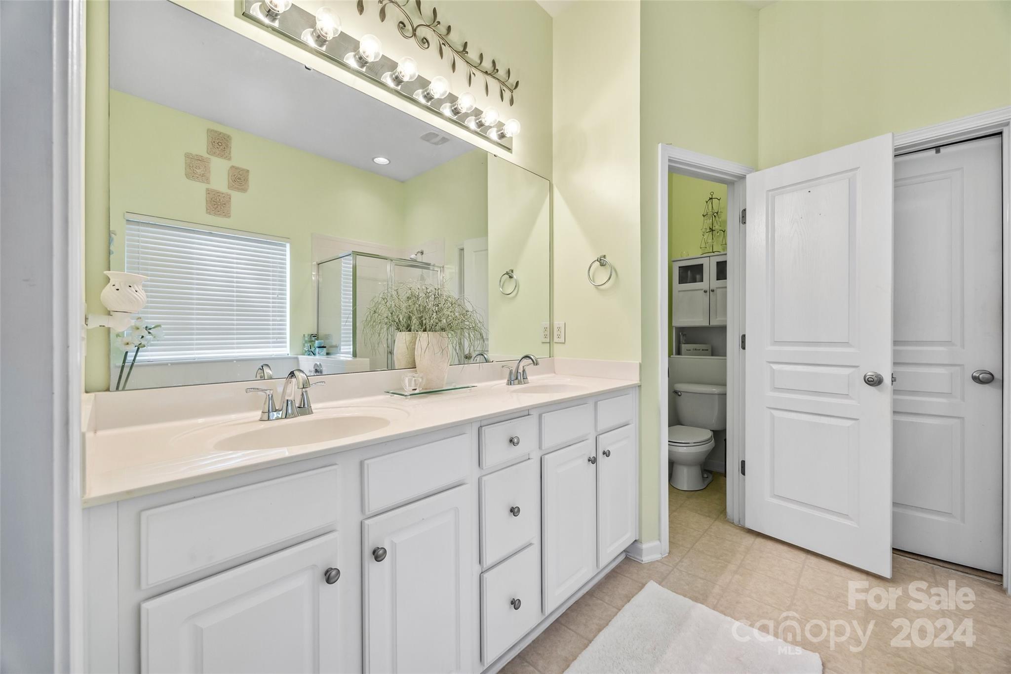 296 Sand Paver Way Fort Mill, SC 29708 - Photo 22 of 41 a spacious bathroom with a double vanity sink a mirror and a shower