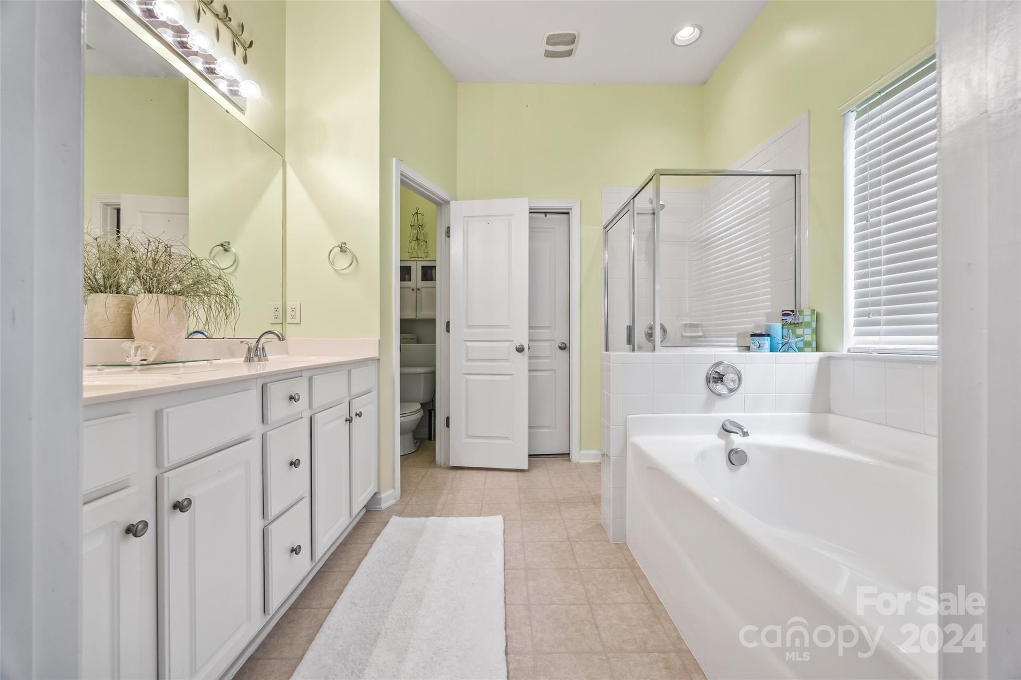 296 Sand Paver Way Fort Mill, SC 29708 - Photo 23 of 41 a spacious bathroom with a tub sink shower and mirror
