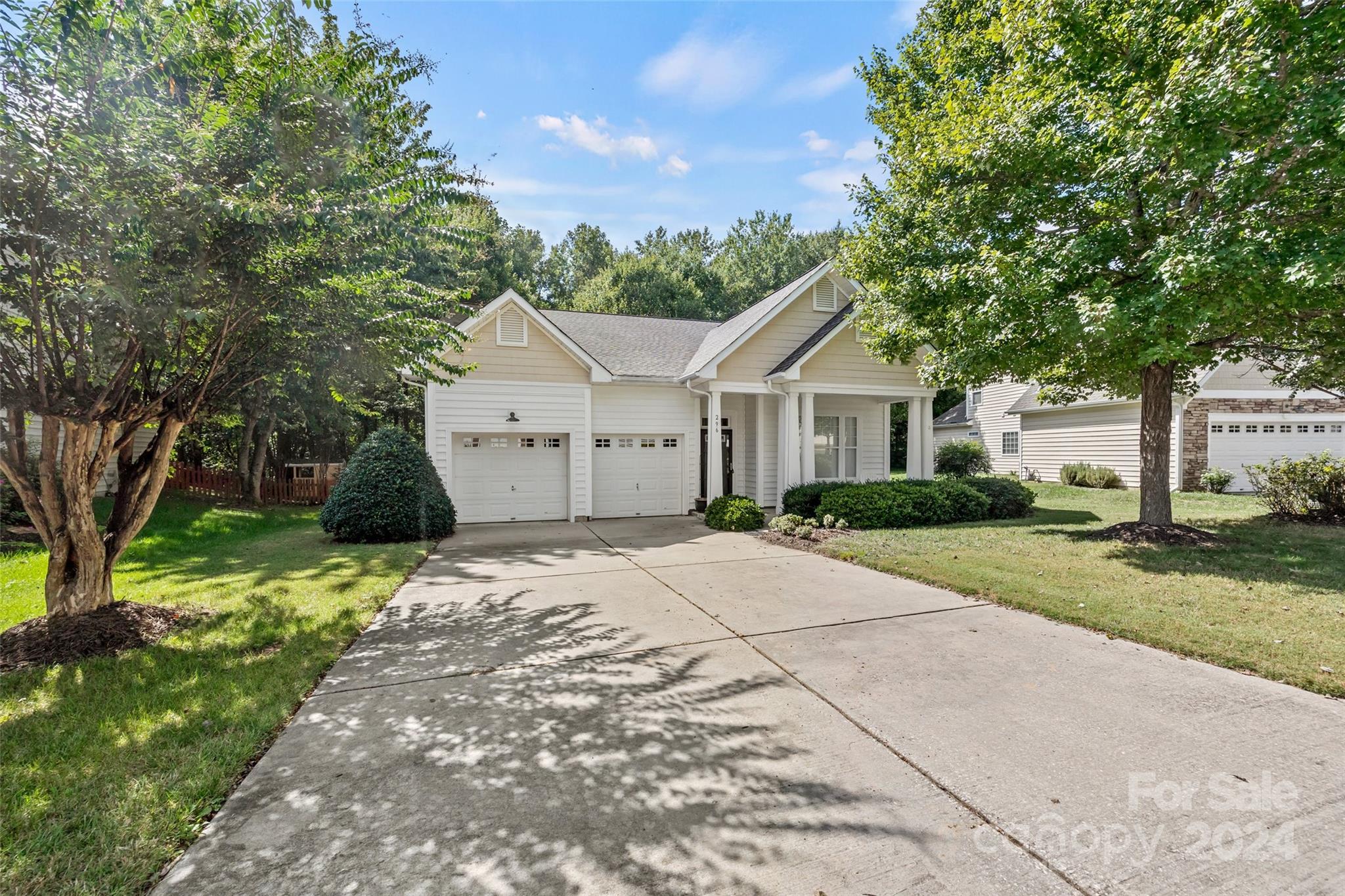296 Sand Paver Way Fort Mill, SC 29708 - Photo 3 of 41 a front view of a house with a yard and garage