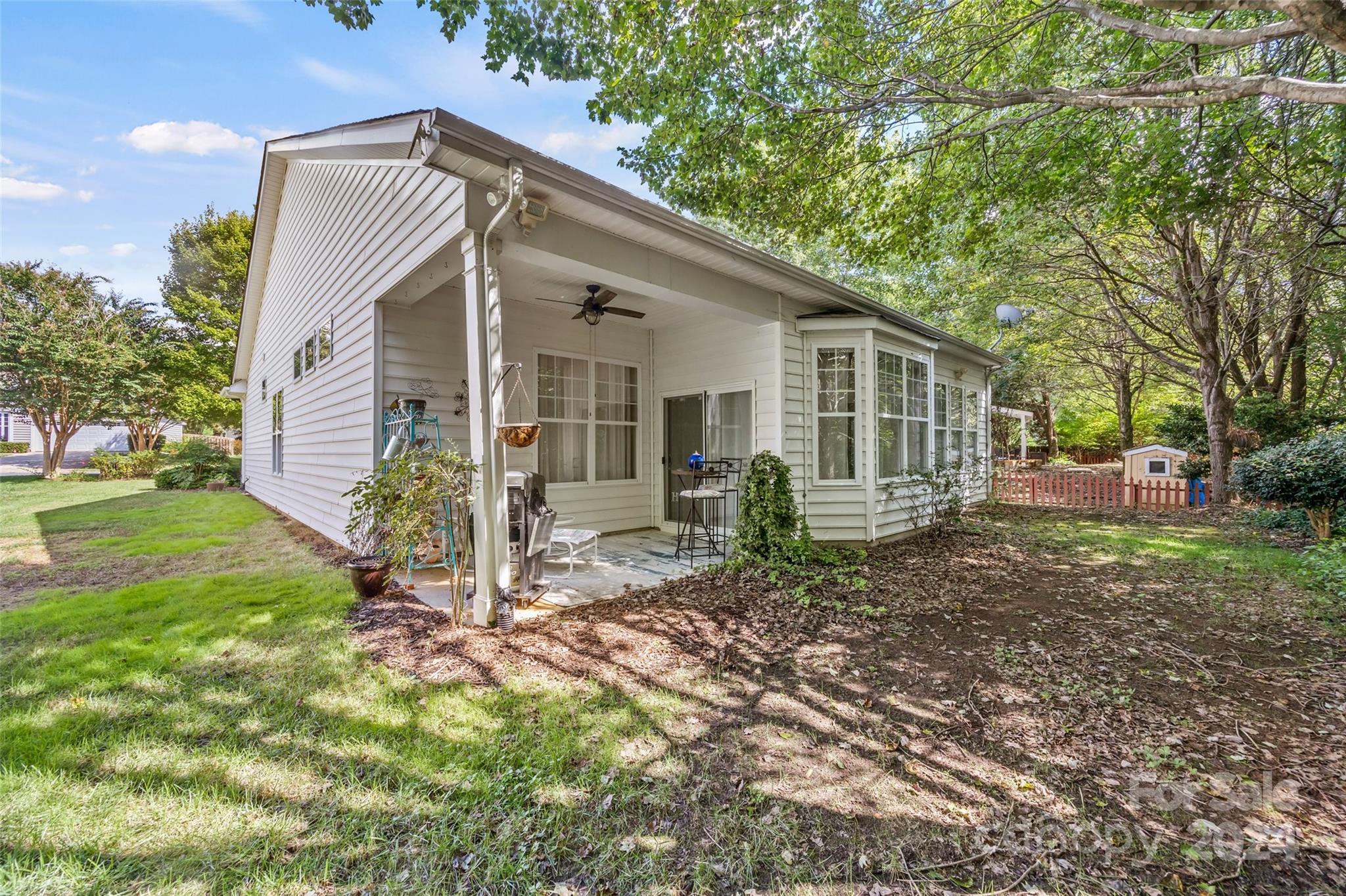 296 Sand Paver Way Fort Mill, SC 29708 - Photo 32 of 41 a view of a house with backyard and a garden