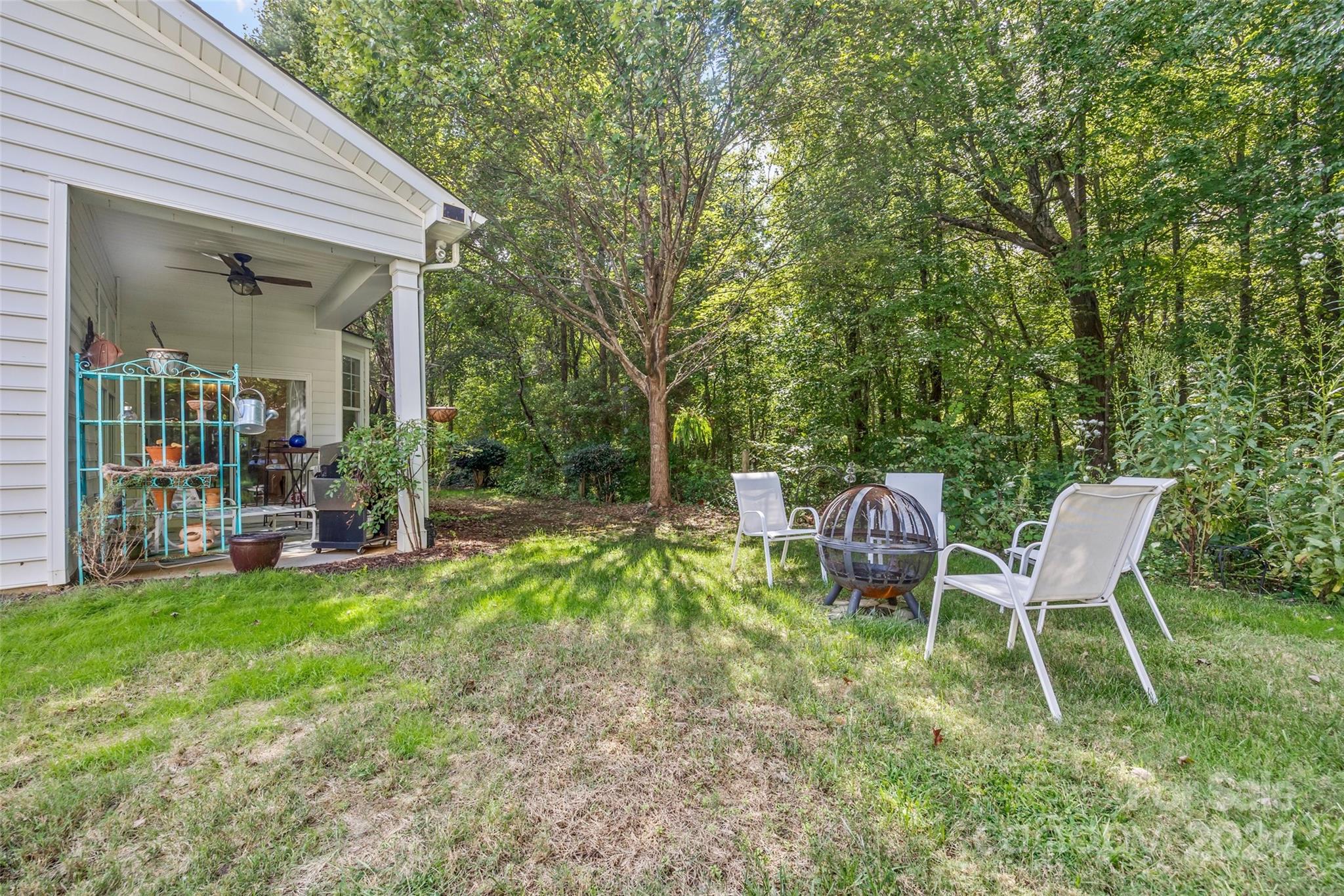 296 Sand Paver Way Fort Mill, SC 29708 - Photo 33 of 41 a view of a chair and table in backyard of the house