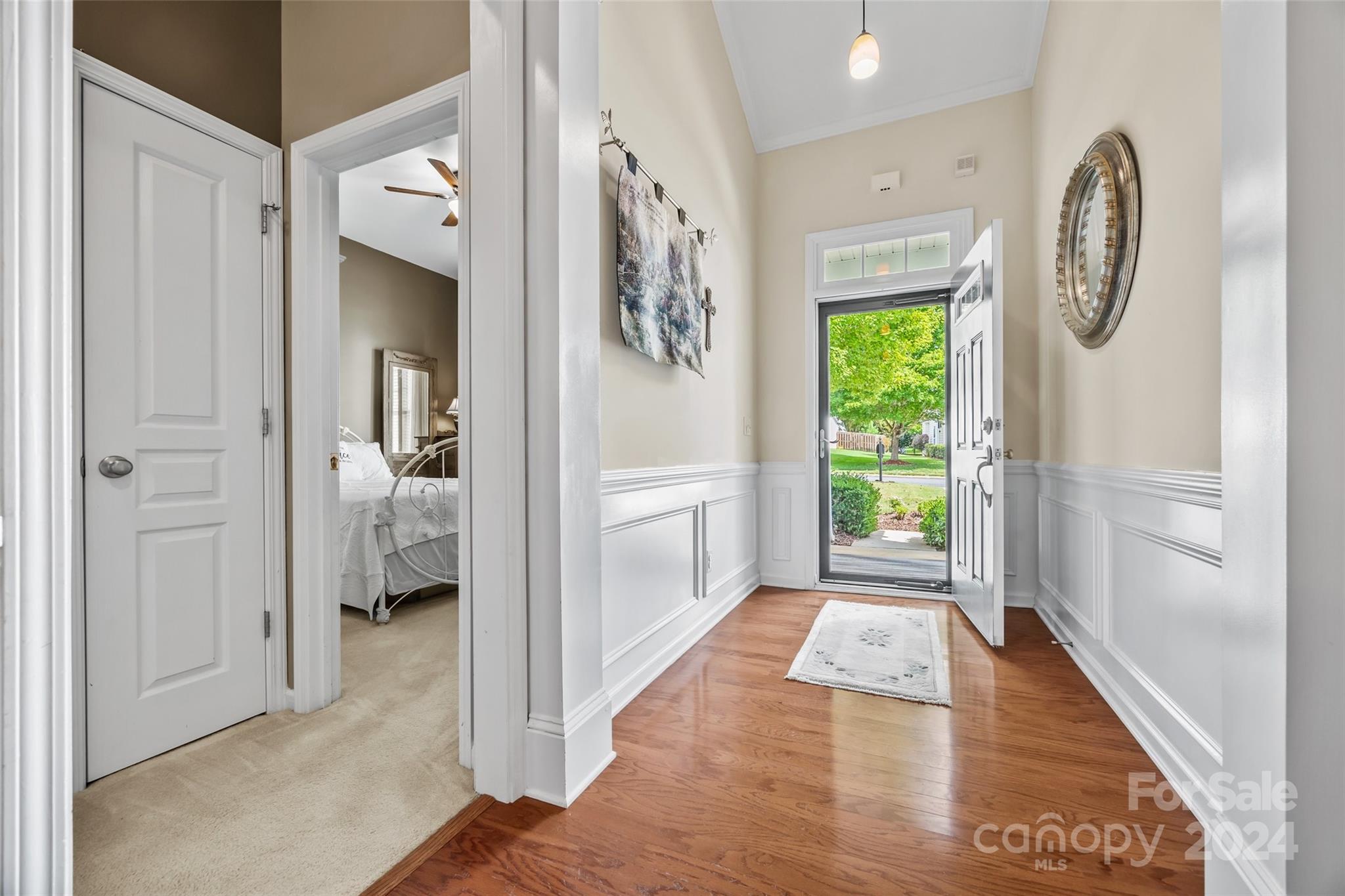 296 Sand Paver Way Fort Mill, SC 29708 - Photo 5 of 41 a view of a hallway with wooden floor and a living room