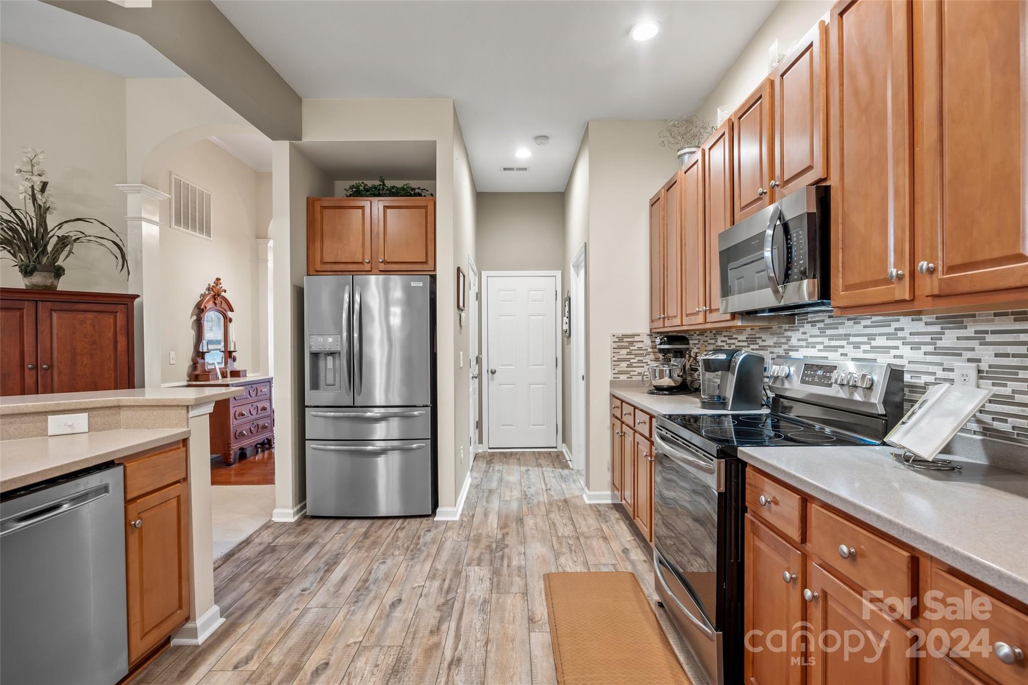 296 Sand Paver Way Fort Mill, SC 29708 - Photo 7 of 41 a kitchen with a refrigerator stove and sink