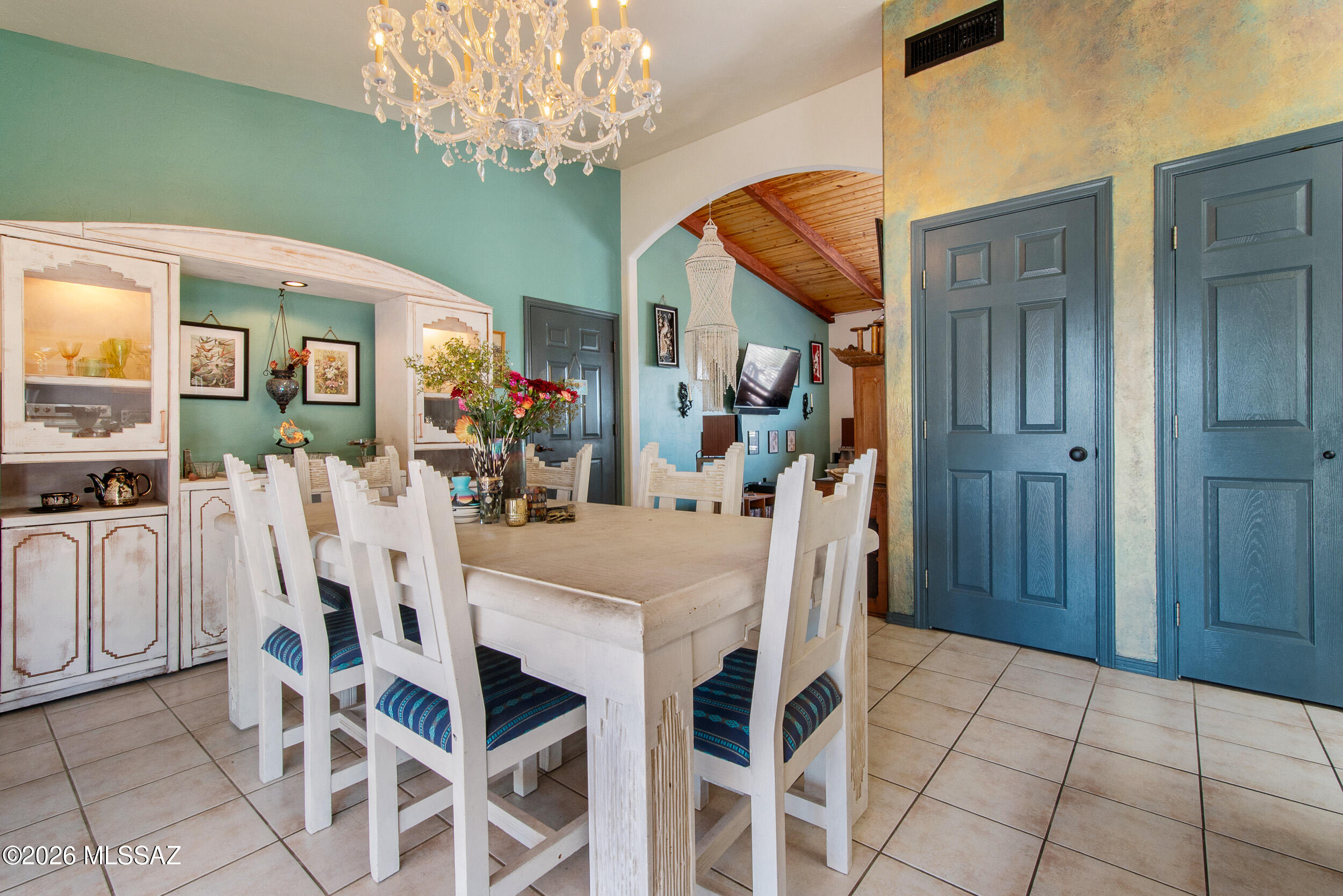 4155 West Coyote Ridge Trail Tucson, AZ 85746 - Photo 18 of 39 a view of a dining room with furniture and chandelier