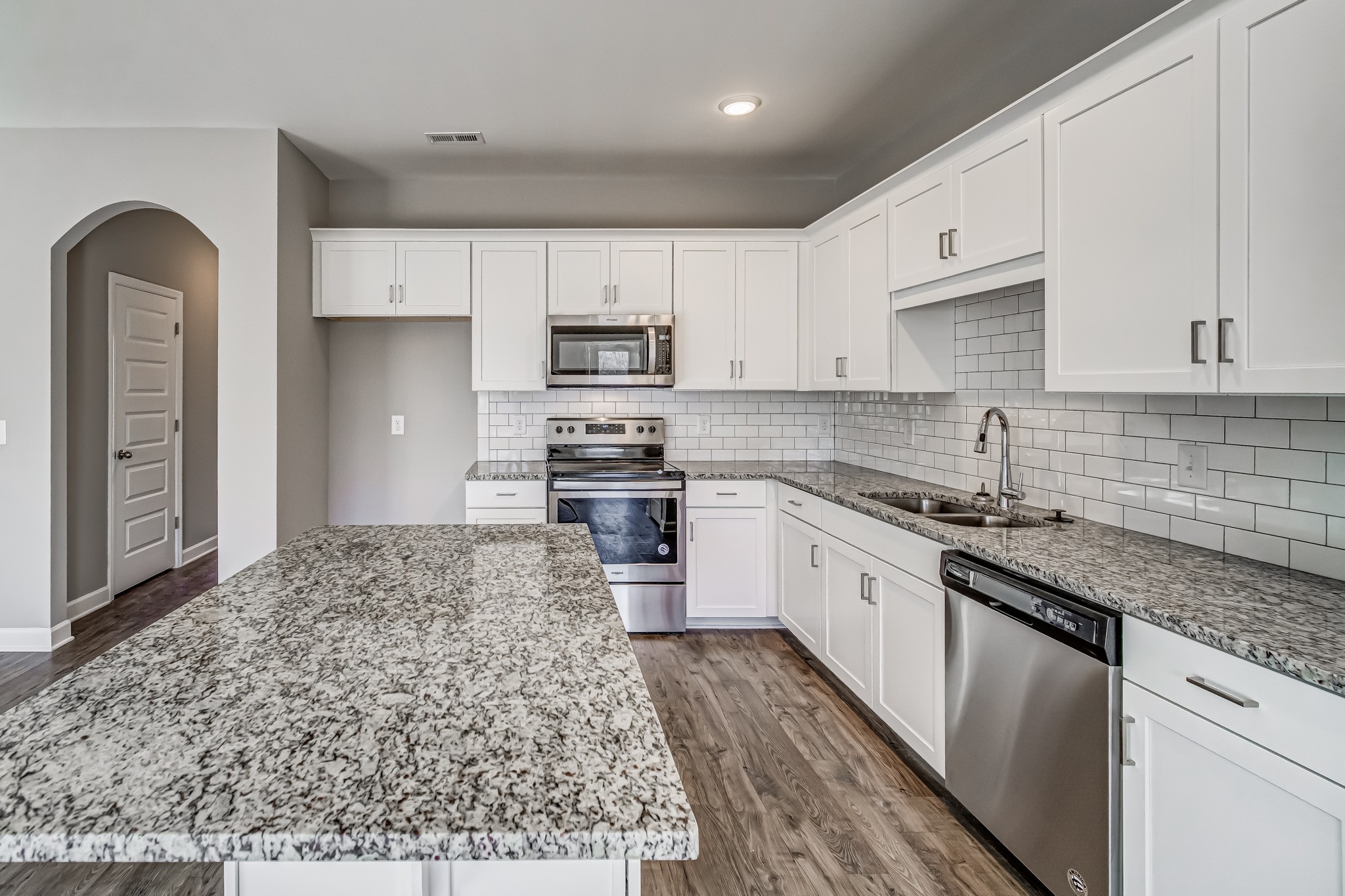 161 Rothwood Pvt Hendersonville, TN 37075 - Photo 8 of 29 a large kitchen with stainless steel appliances granite countertop a stove a sink and a white cabinets