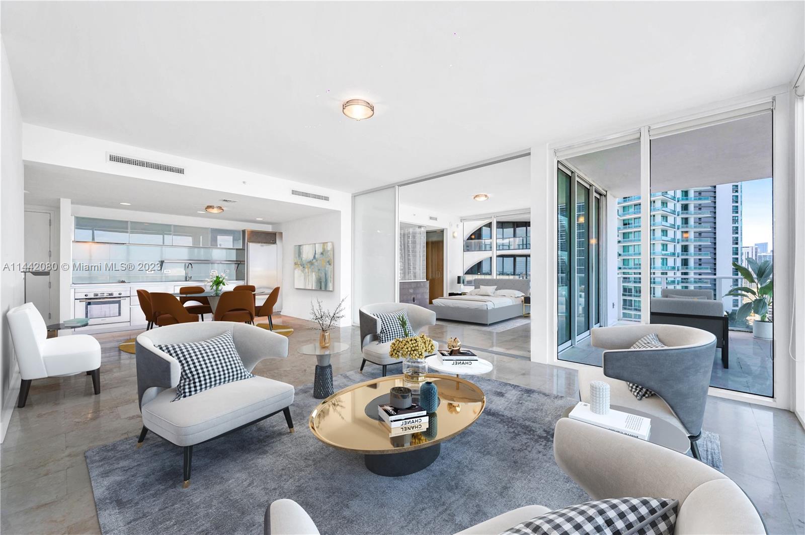 1040 Biscayne Boulevard, Unit 2107 Miami, FL 33132 - Photo 11 of 50 a living room with furniture and a large window