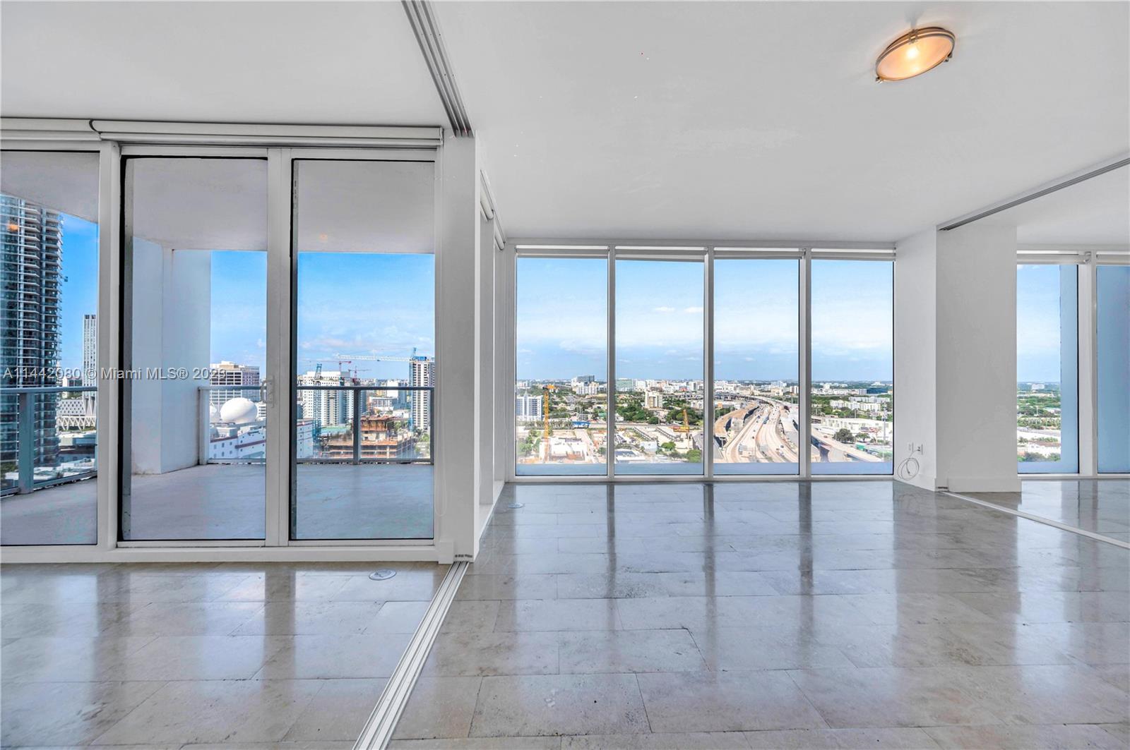 1040 Biscayne Boulevard, Unit 2107 Miami, FL 33132 - Photo 14 of 50 a view of an empty room and window