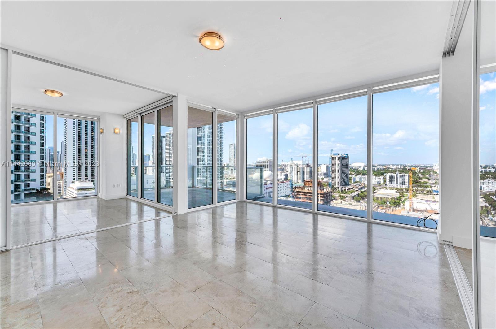 1040 Biscayne Boulevard, Unit 2107 Miami, FL 33132 - Photo 15 of 50 a view of an entryway with floor to ceiling window and an empty room