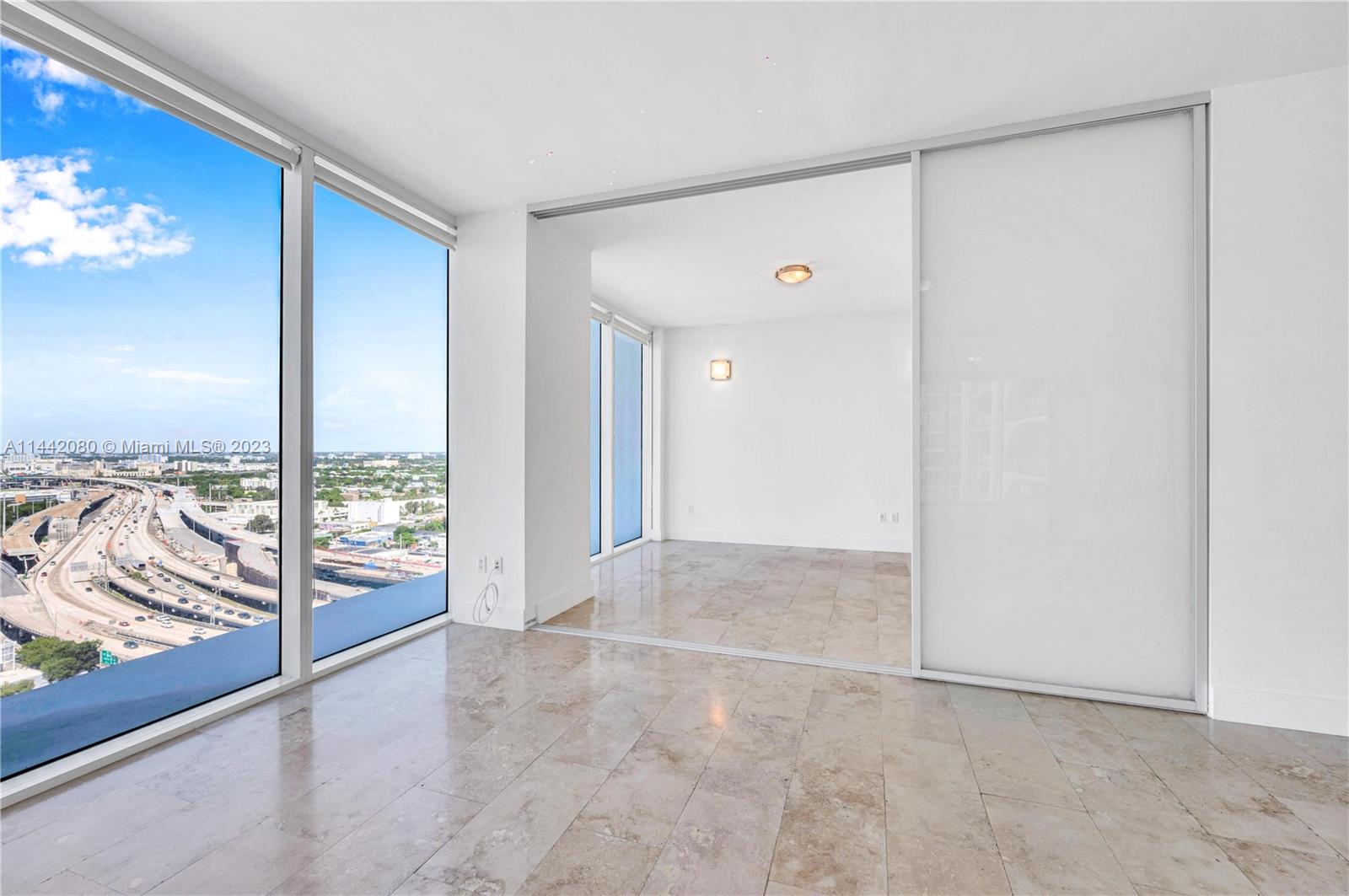 1040 Biscayne Boulevard, Unit 2107 Miami, FL 33132 - Photo 20 of 50 a view of an empty room and a window