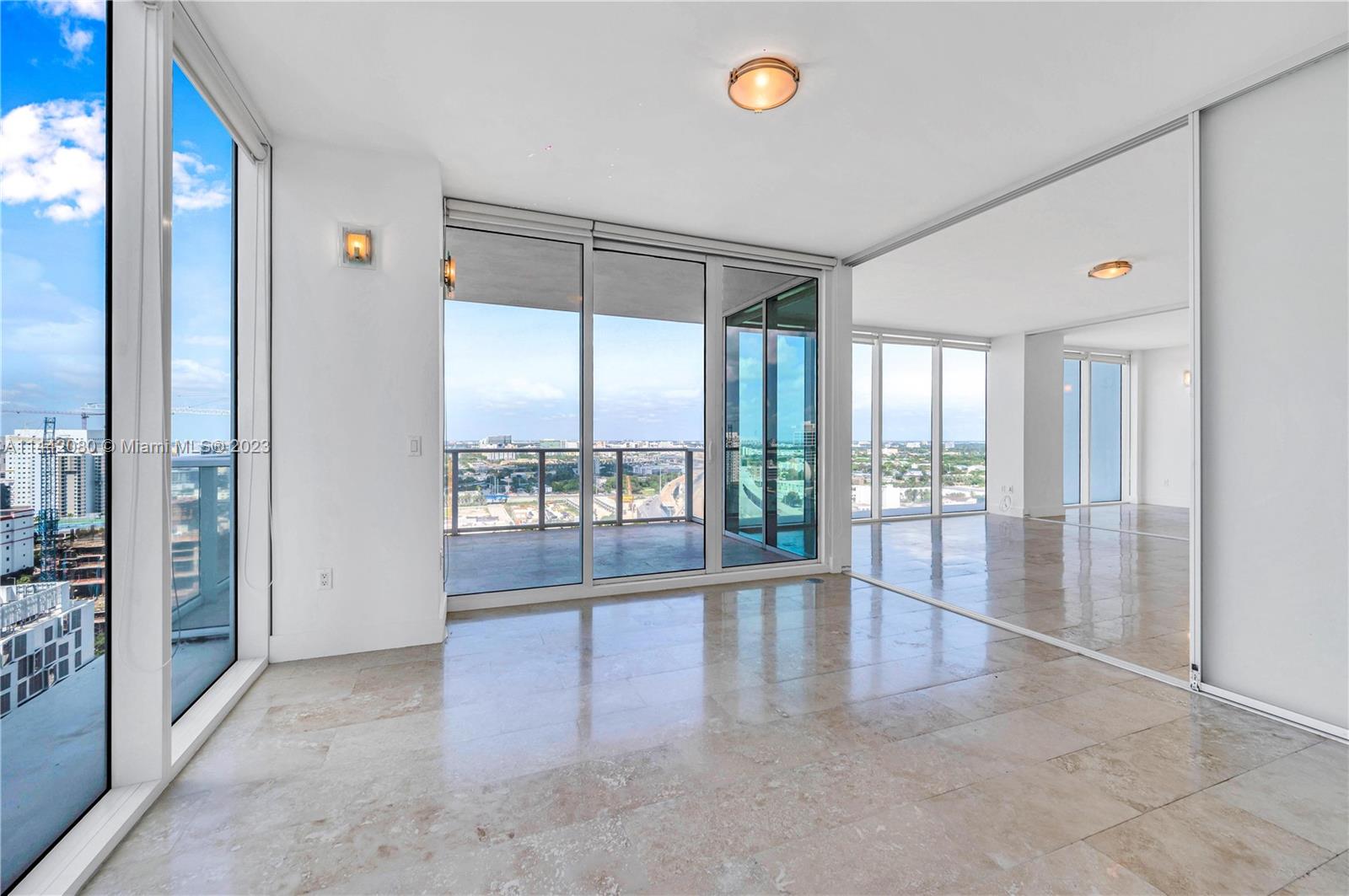 1040 Biscayne Boulevard, Unit 2107 Miami, FL 33132 - Photo 21 of 50 a view of an empty room and window