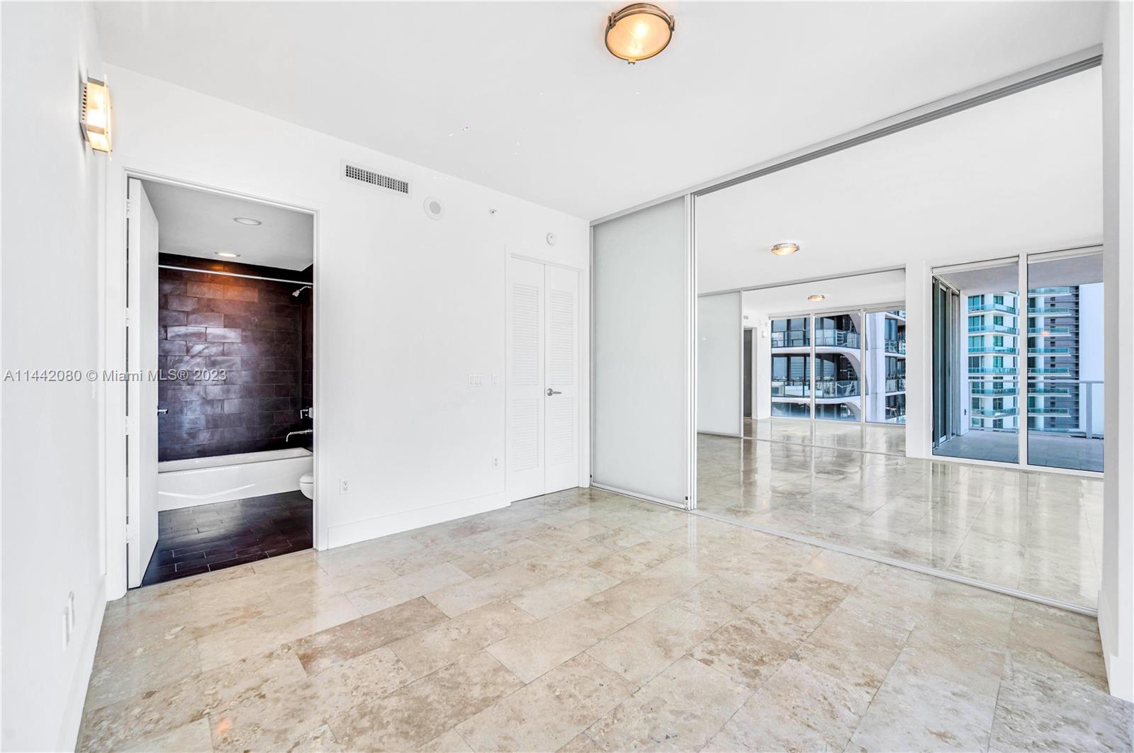 1040 Biscayne Boulevard, Unit 2107 Miami, FL 33132 - Photo 28 of 50 wooden floor in an empty room
