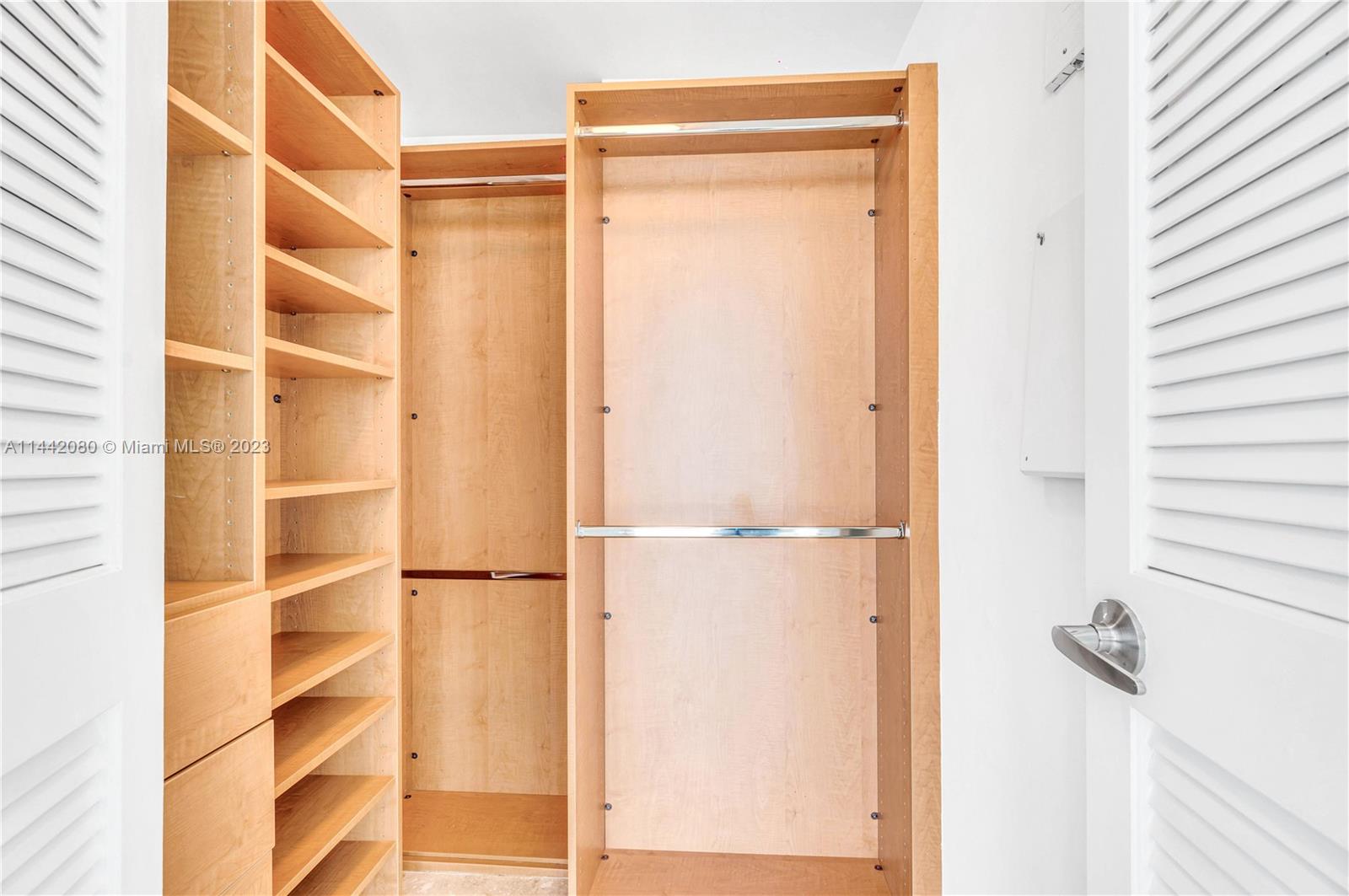 1040 Biscayne Boulevard, Unit 2107 Miami, FL 33132 - Photo 30 of 50 a bathroom with a glass shower door