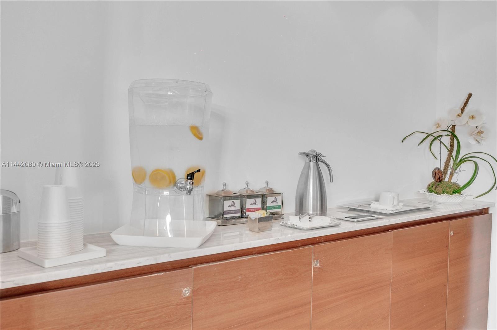 1040 Biscayne Boulevard, Unit 2107 Miami, FL 33132 - Photo 45 of 50 a kitchen with a faucet a sink and a counter top space