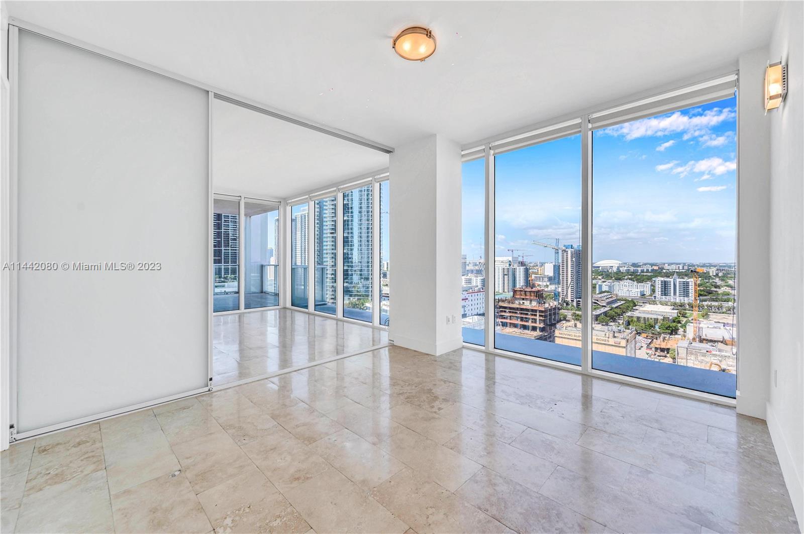 1040 Biscayne Boulevard, Unit 2107 Miami, FL 33132 - Photo 10 of 50 a view of an empty room with a window