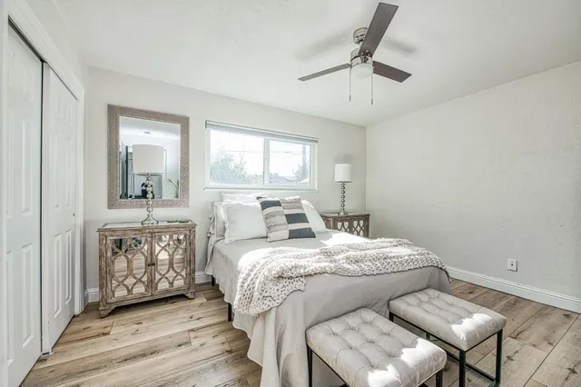 a bedroom with a bed and a chair