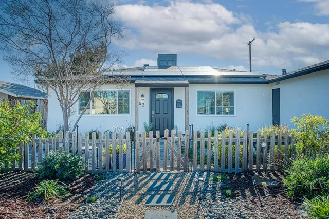 a view of a house with a garden