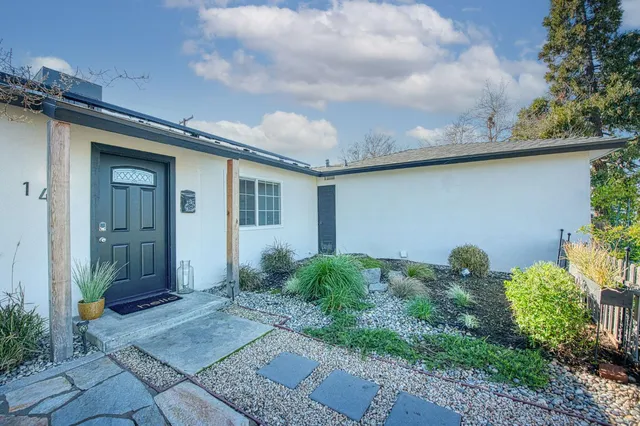 a house view with a garden space