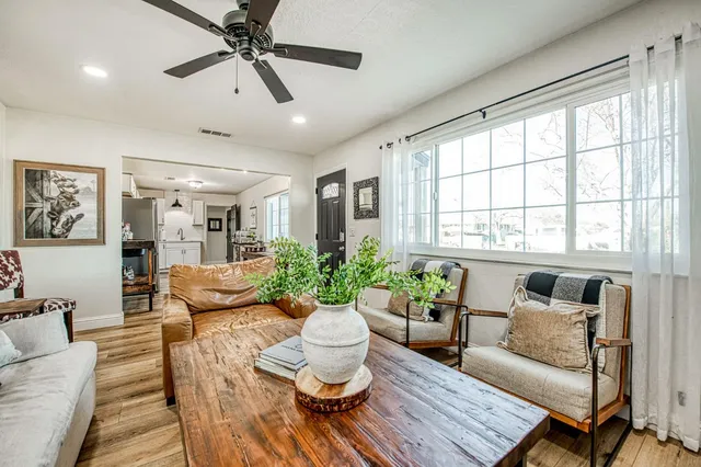 a living room with furniture and a large window