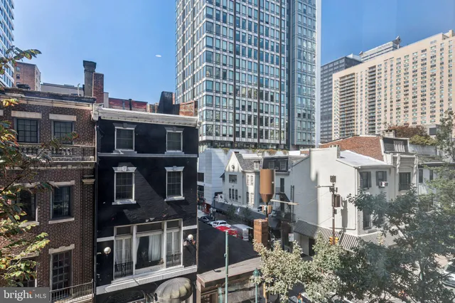 a city street filled with lots of tall buildings