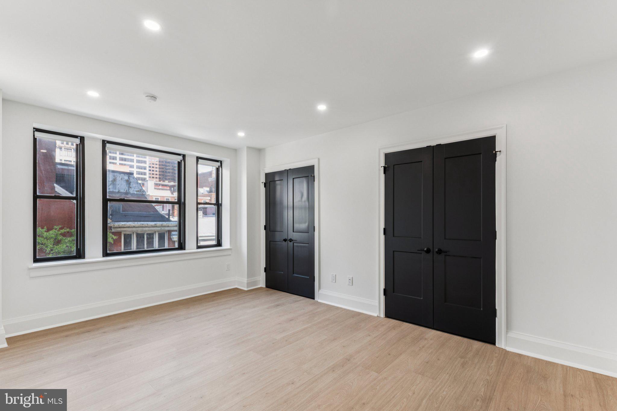 135 South 19th Street, Unit 308 Philadelphia, PA 19103 - Photo 10 of 24 a view of an empty room with a window