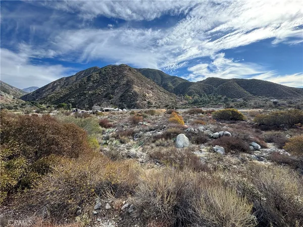 a view of mountains and valleys